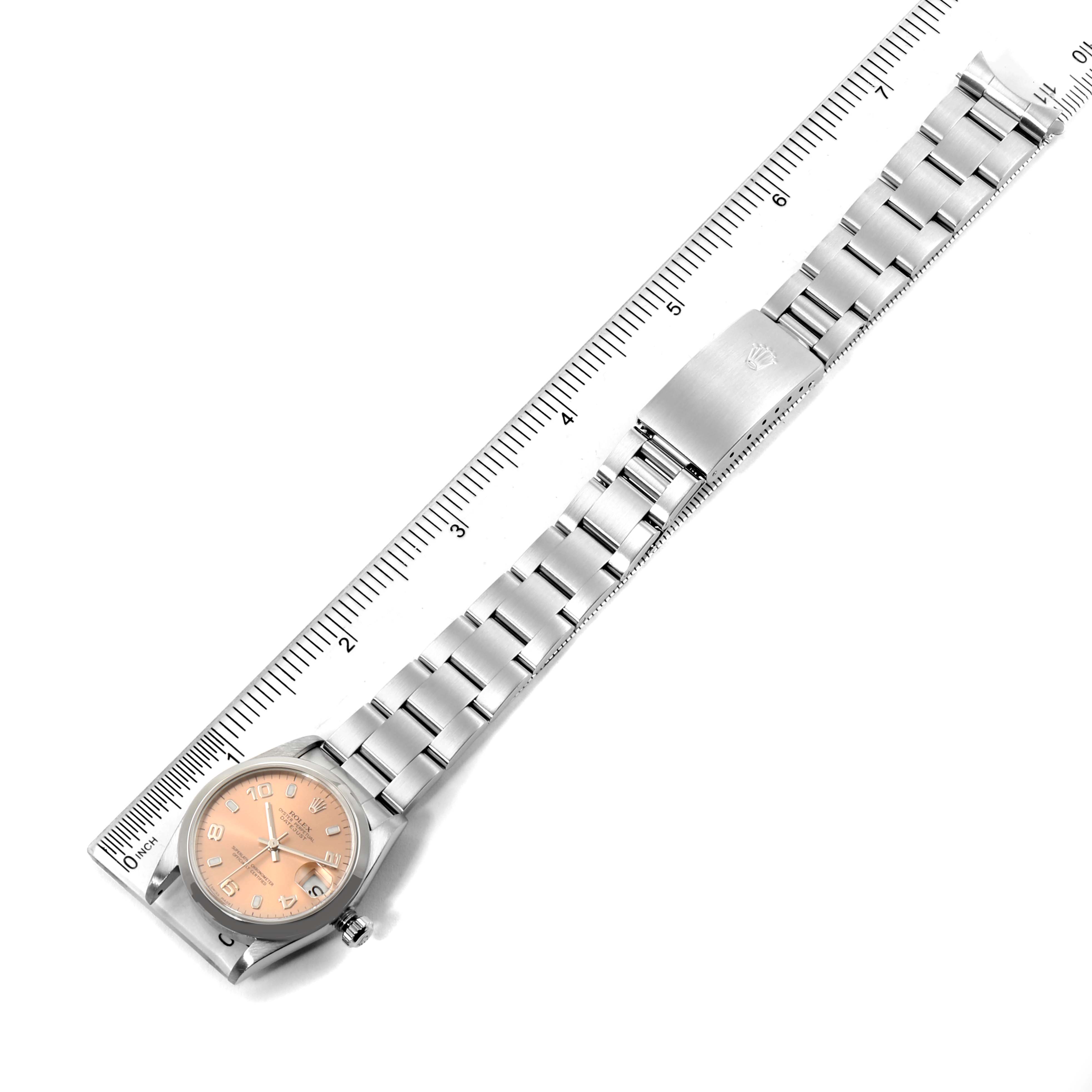 The image displays a Rolex Mid-Size 78240 Women's Stainless Steel Pink Dial 78240 Women's Stainless Steel Pink Dial model watch laid out flat, showing the face, bracelet, and clasp against a ruler for size reference.