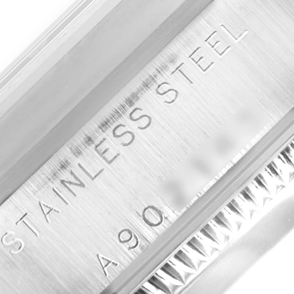 This close-up image showcases the stainless steel case and serial number engraved on a Rolex Mid-Size 78240 Women's Stainless Steel Pink Dial 78240 Women's Stainless Steel Pink Dial watch.