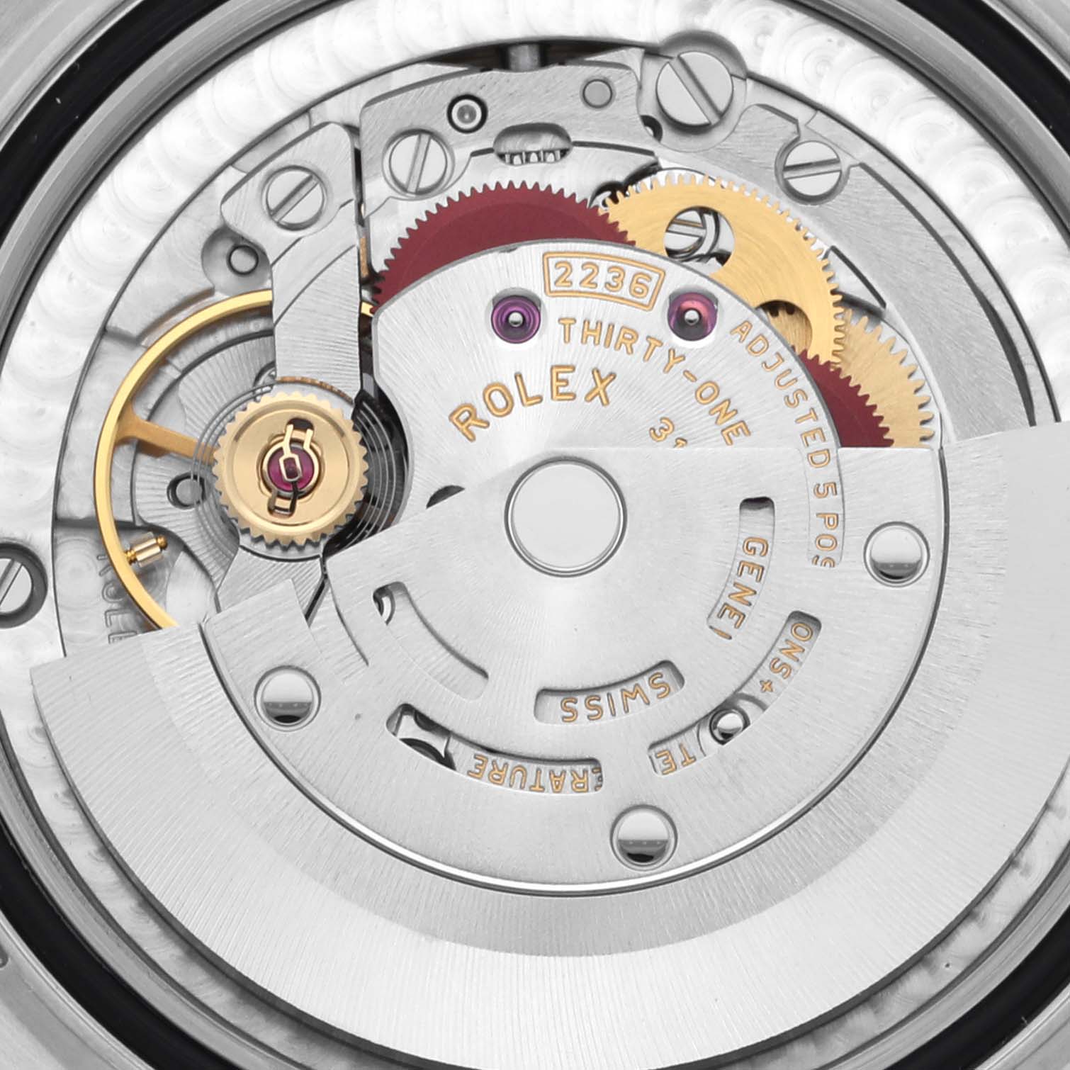 The image shows a close-up of the Rolex Mid-Size 278343RBR-0032 Women's Steel and Gold (two tone) Green Dial 278343RBR-0032 Women's Steel and Gold (two tone) Green Dial model's movement, highlighting gears, rotors, and engravings.