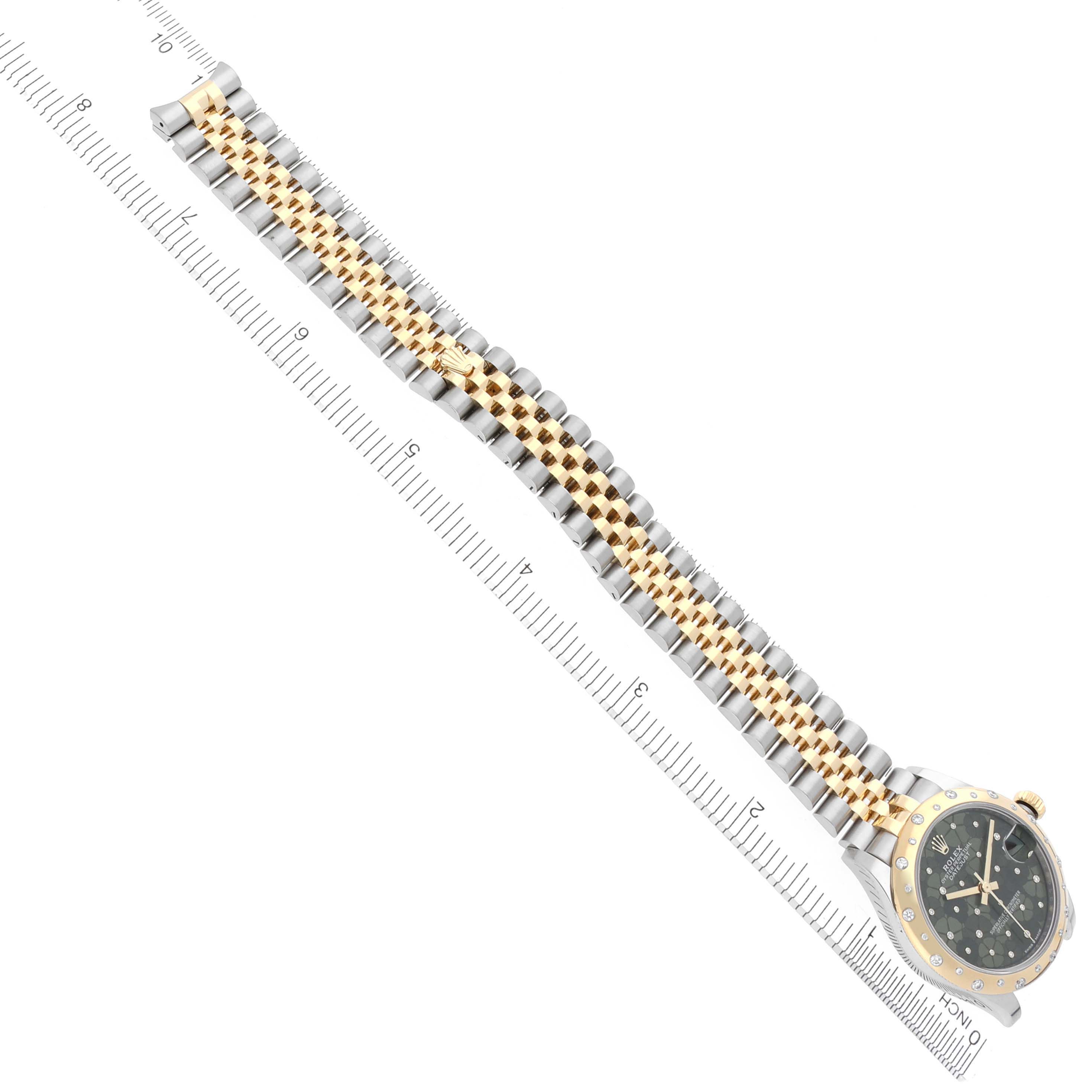 The image shows a Rolex Mid-Size 278343RBR-0032 Women's Steel and Gold (two tone) Green Dial 278343RBR-0032 Women's Steel and Gold (two tone) Green Dial watch from a top view, featuring its full bracelet and face with a ruler for scale.