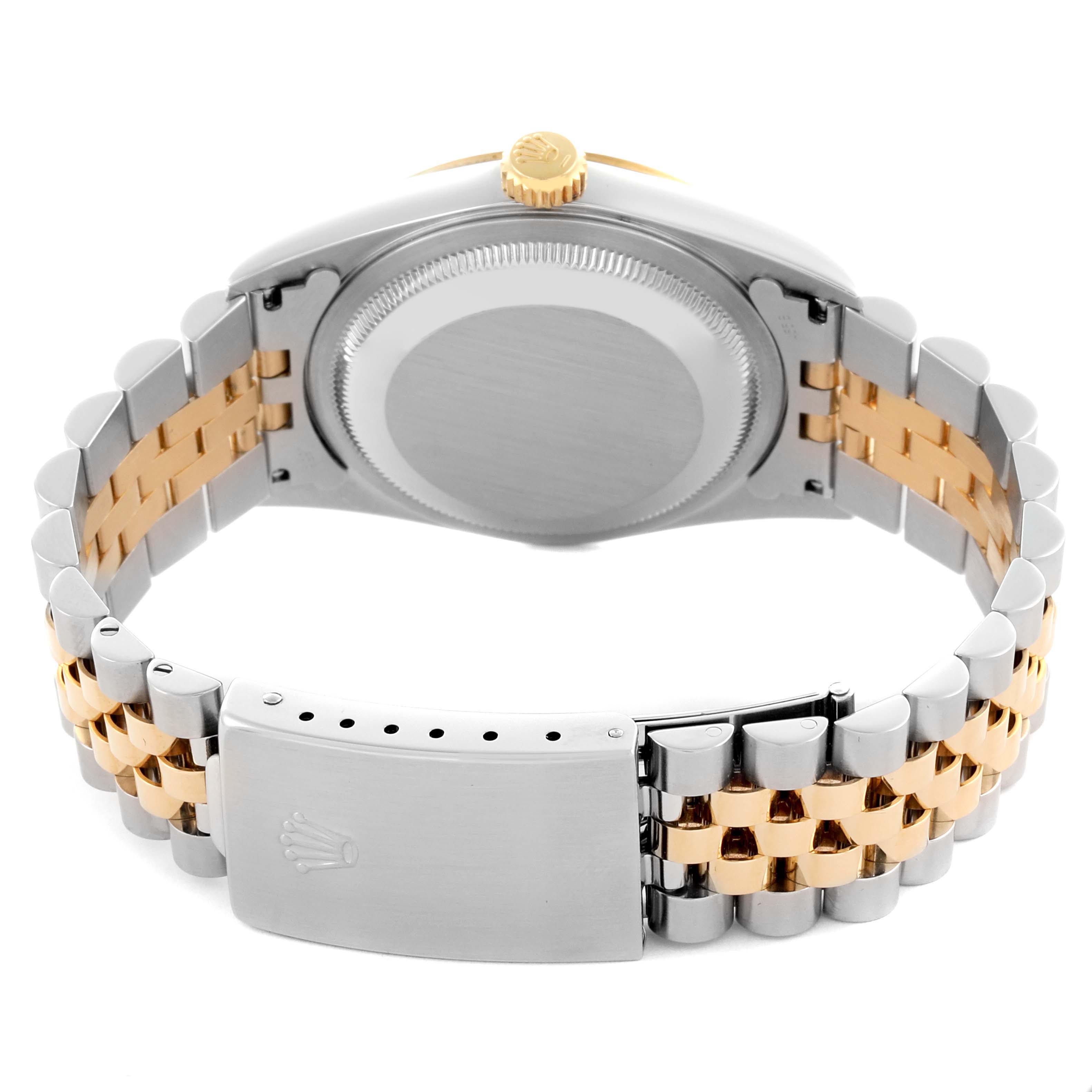 The image shows the backside of a Rolex Datejust 16233 Men's Steel and Gold (two tone) Mother of Pearl Dial 16233 Men's Steel and Gold (two tone) Mother of Pearl Dial, highlighting the clasp, bracelet, case back, and crown from a rear angle.