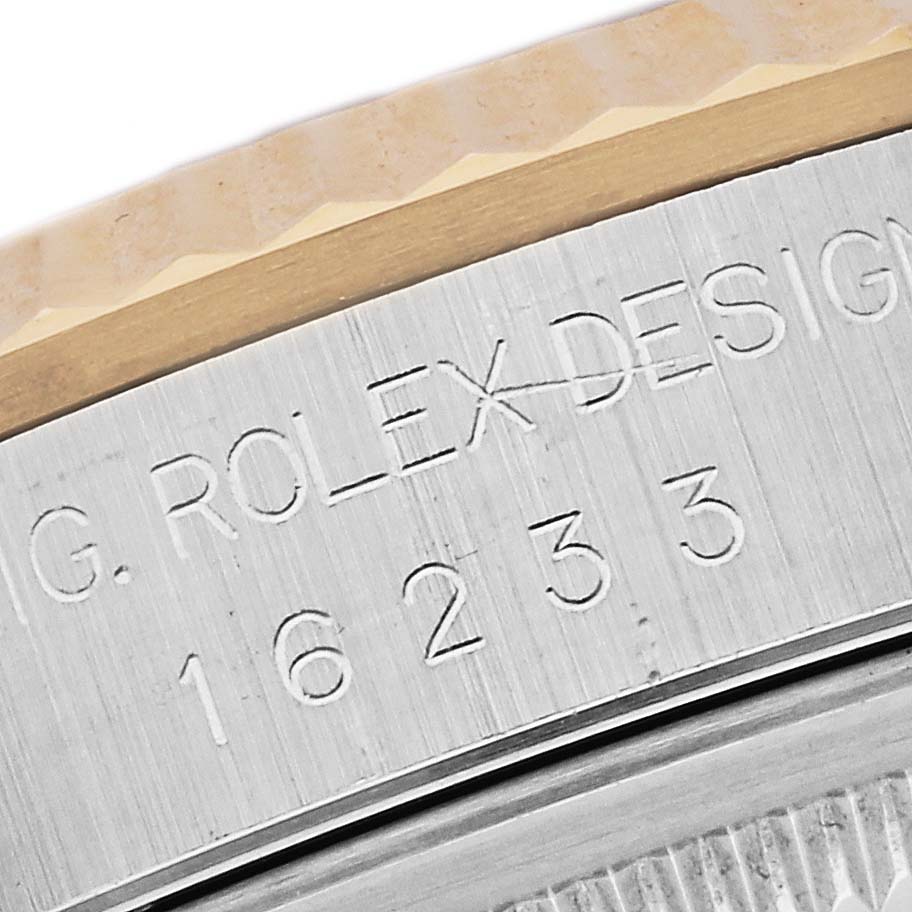 The image shows a close-up of the Rolex Datejust 16233 Men's Steel and Gold (two tone) Mother of Pearl Dial 16233 Men's Steel and Gold (two tone) Mother of Pearl Dial model's case side, displaying engraved model and brand details.