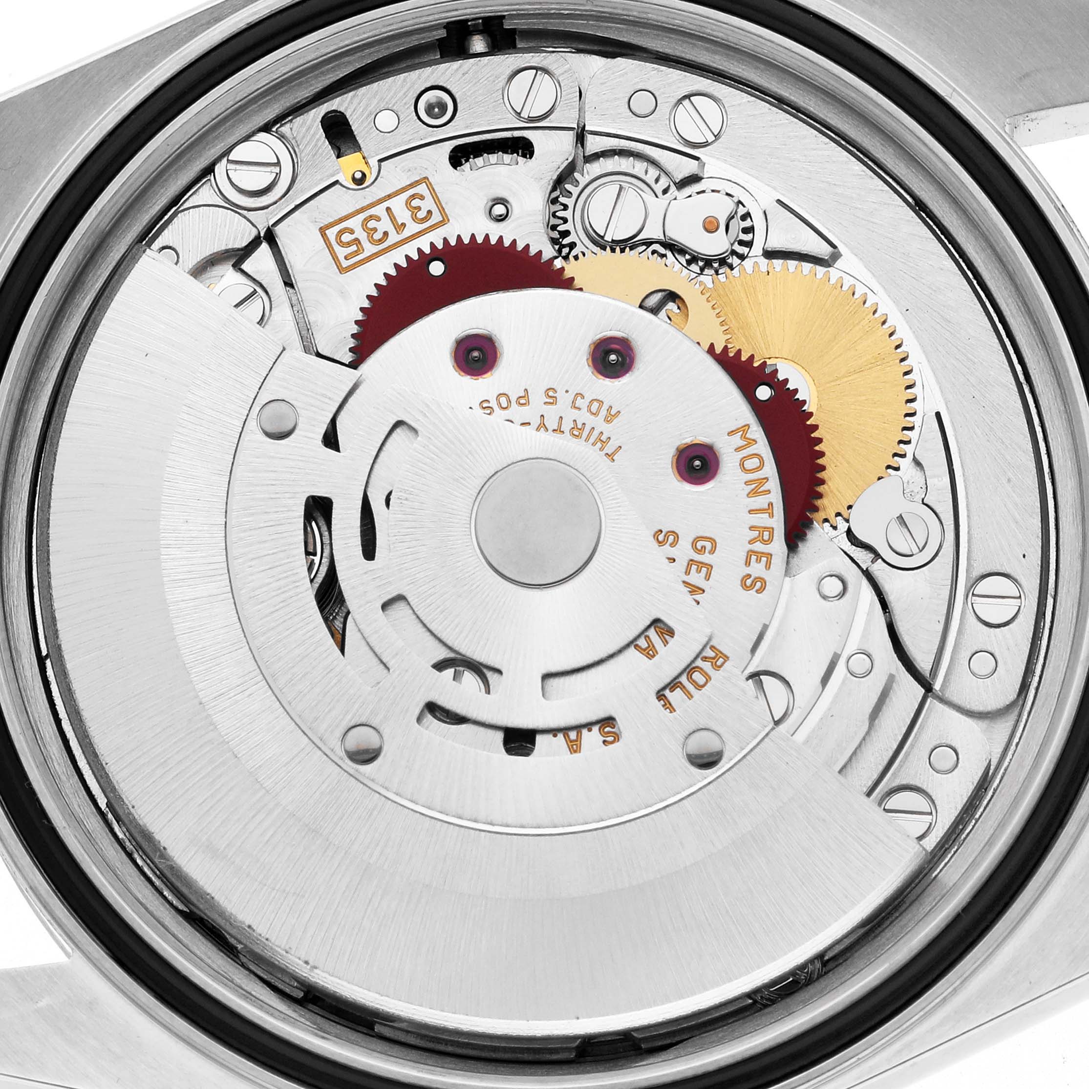 The image shows the movement mechanism of a Rolex Datejust 16233 Men's Steel and Gold (two tone) Mother of Pearl Dial 16233 Men's Steel and Gold (two tone) Mother of Pearl Dial watch from a top-down angle, highlighting gears and rotors.