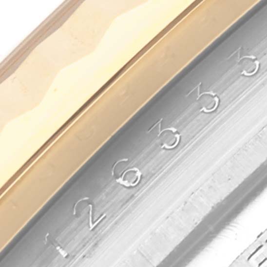 The image shows a close-up of the bezel and partial dial of a Rolex Datejust 41 126333 Men's Steel and Gold (two tone) Black Dial 126333 Men's Steel and Gold (two tone) Black Dial, highlighting the fluted edge and date markings.