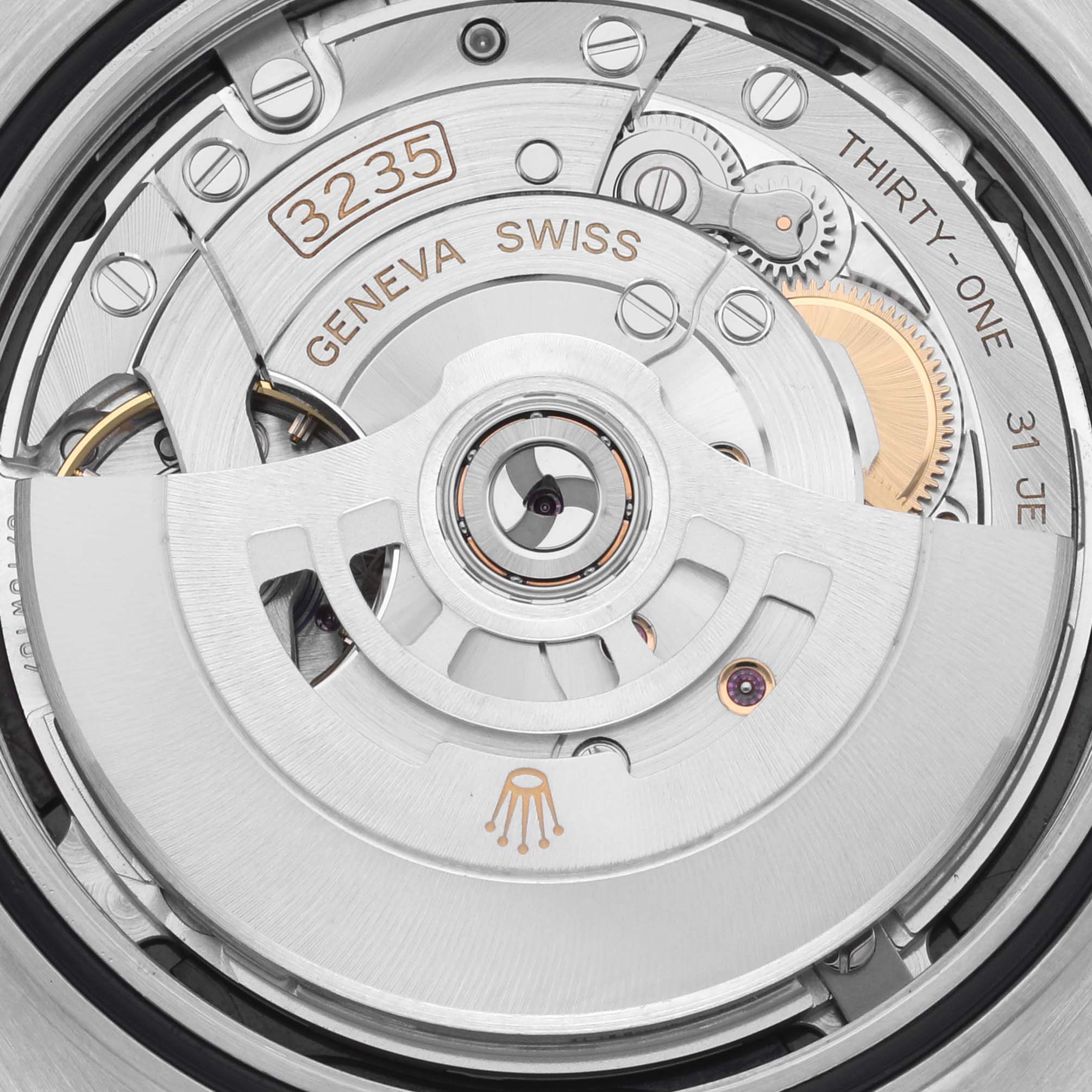 The image shows the movement of a Rolex Datejust 41 126333 Men's Steel and Gold (two tone) Black Dial 126333 Men's Steel and Gold (two tone) Black Dial, highlighting the rotor and intricate mechanical parts from the back.
