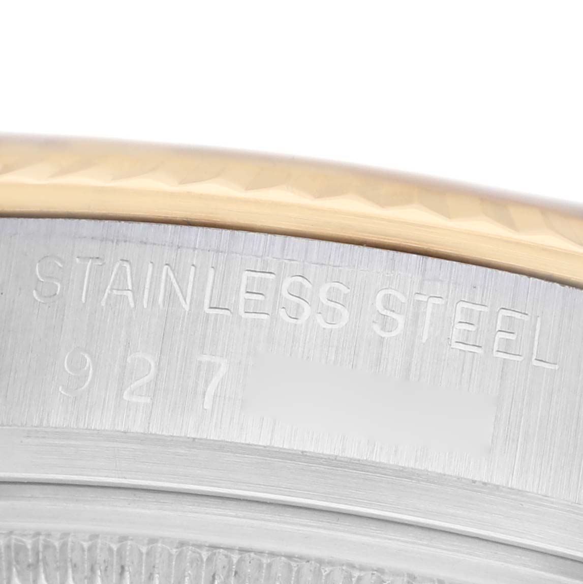 The image shows a close-up of the casing edge of a Rolex Datejust 16013 Men's Stainless Steel Champagne Dial, highlighting the engraved text and metal texture.