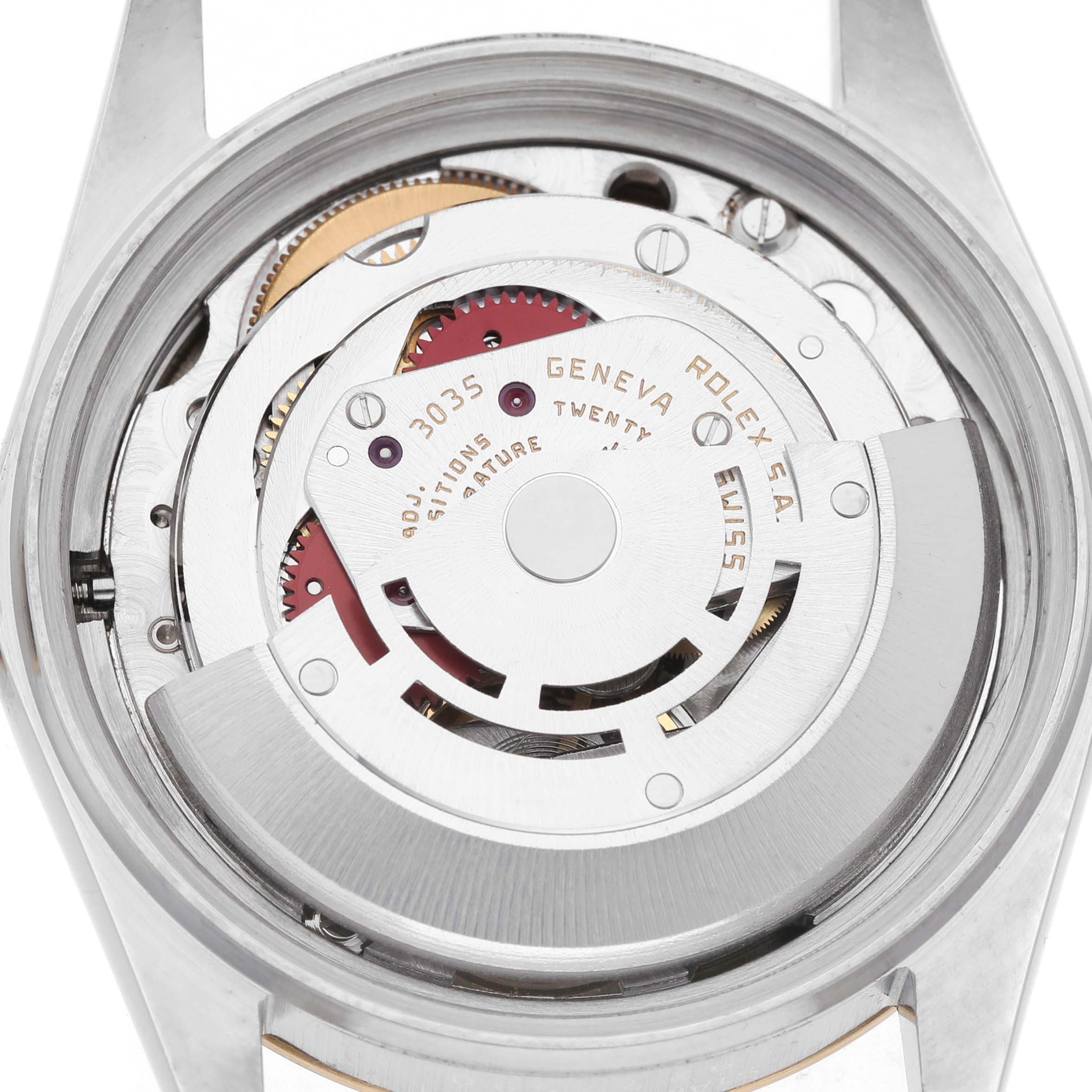 The image shows a close-up of the movement from the back of a Rolex Datejust 16013 Men's Stainless Steel Champagne Dial watch.