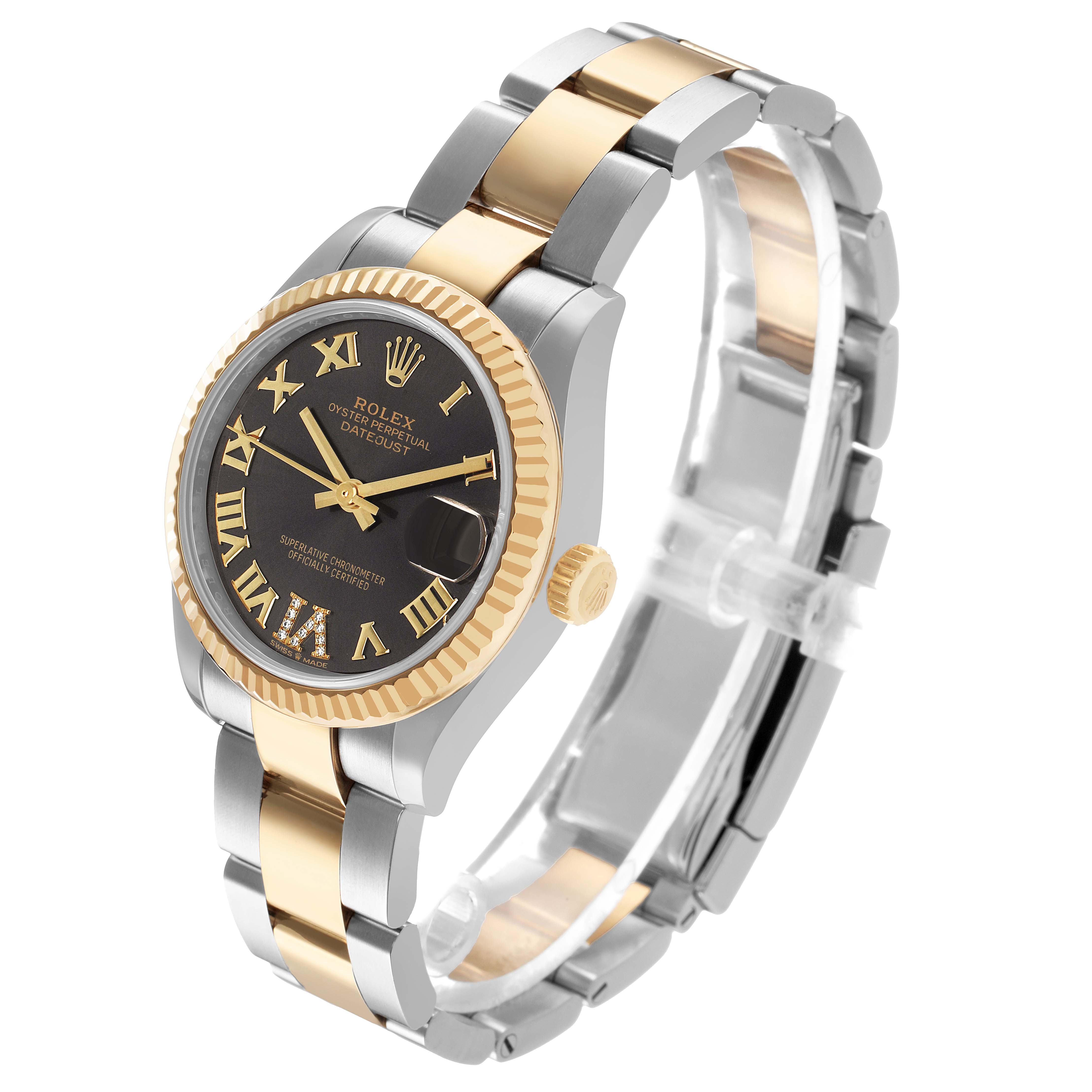 This Rolex Mid-Size 278273 Women's Steel and Gold (two tone) Grey Dial watch is shown at a three-quarter angle, highlighting its gold and silver bracelet, fluted bezel, and black dial.