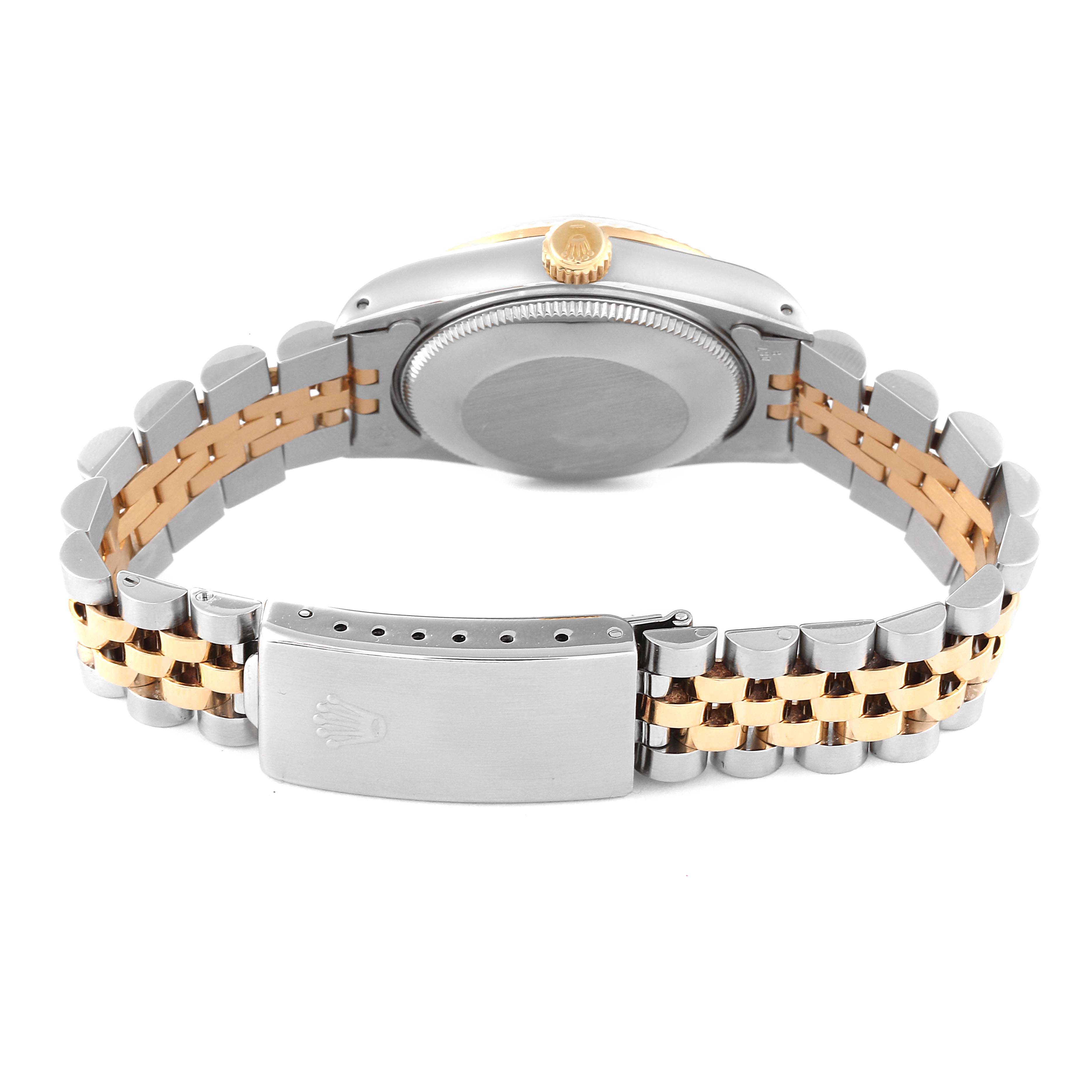 The image shows the back of a Rolex Mid-Size 68273 Women
s Steel and Gold (two tone) Champagne Dial 68273 Women
s Steel and Gold (two tone) Champagne Dial model watch, highlighting its two-tone bracelet and clasp.