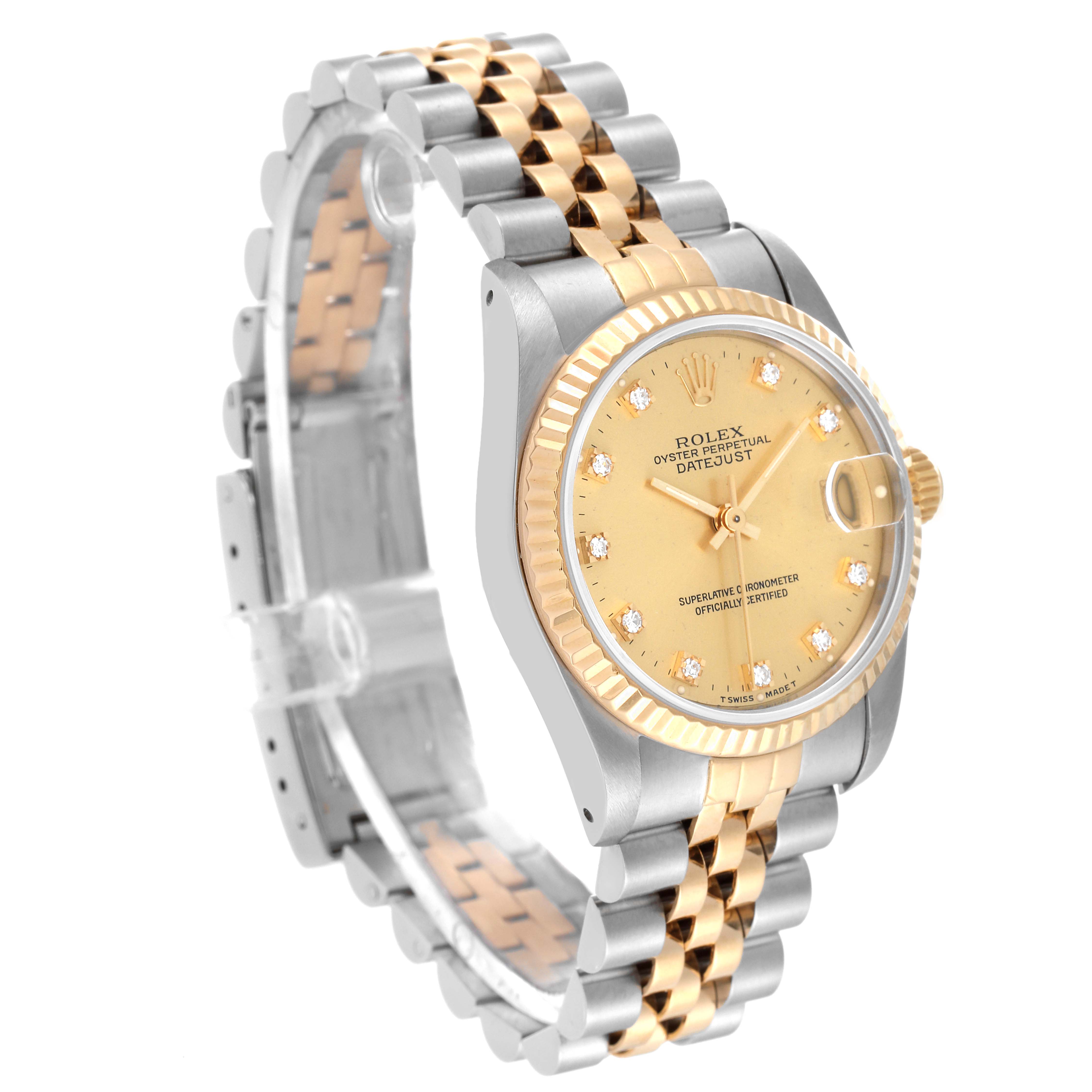 The Rolex Mid-Size 68273 Women
s Steel and Gold (two tone) Champagne Dial 68273 Women
s Steel and Gold (two tone) Champagne Dial watch is shown from an angled side view, highlighting the gold and silver band and the dial with diamond markers.