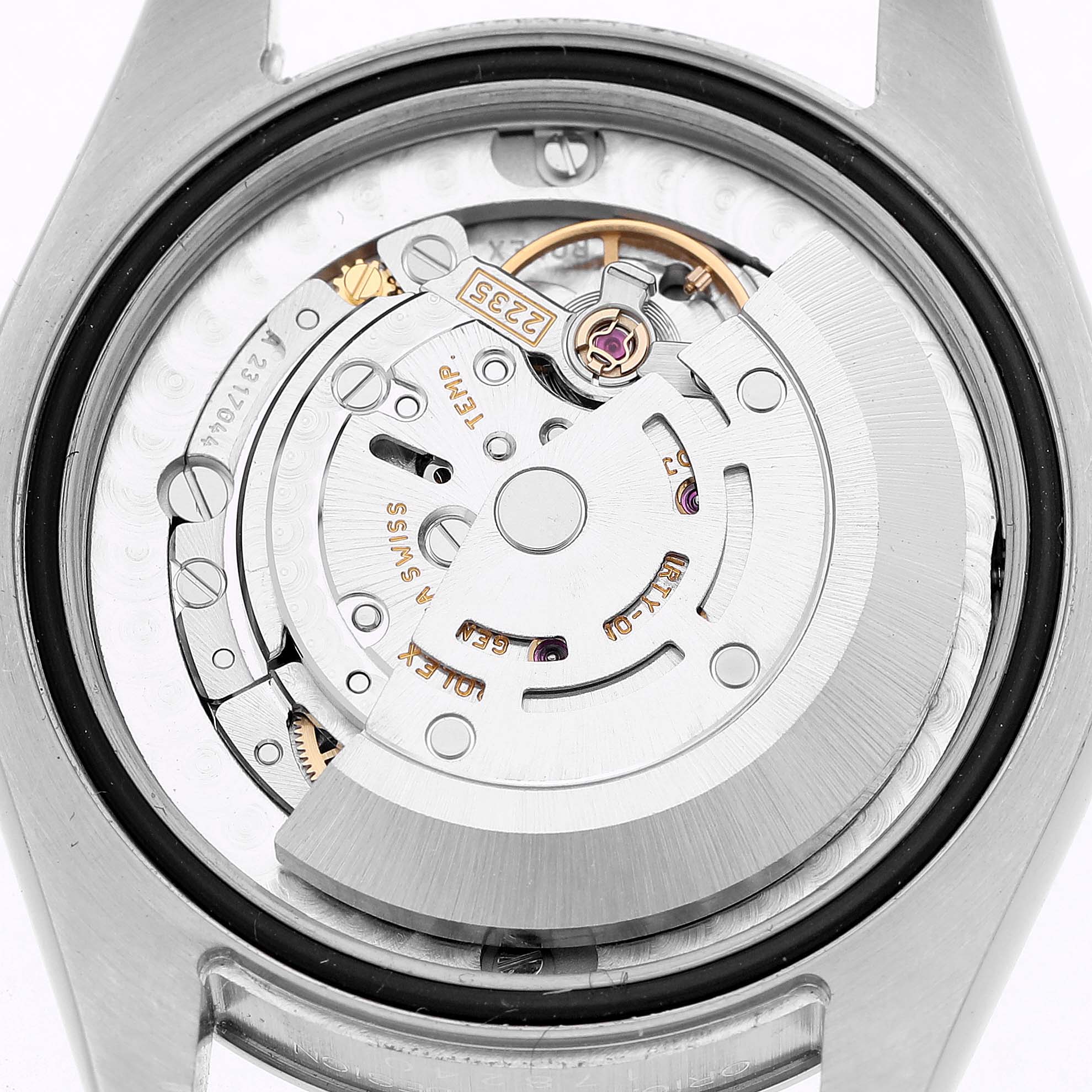 The image shows the open caseback of a Rolex Datejust 178240 Women's Stainless Steel White Dial, revealing the movement and rotor mechanism from a top-down perspective.