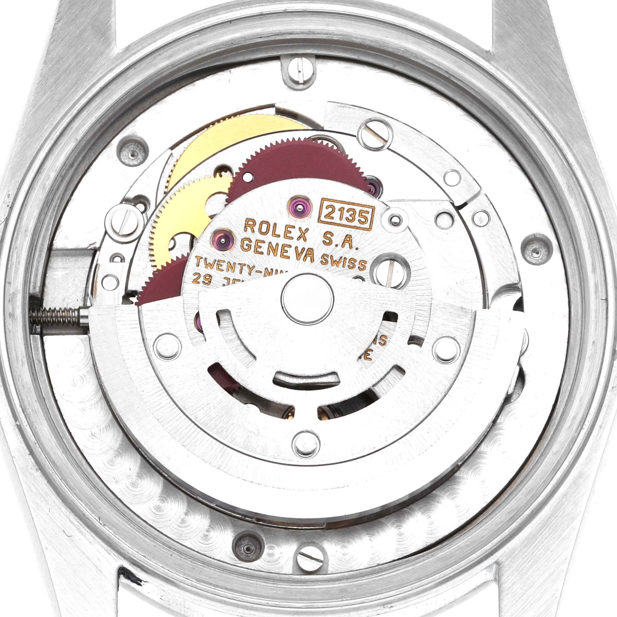 This image shows the movement of the Rolex Mid-Size 68240 Women
s Stainless Steel White Dial 68240 Women
s Stainless Steel White Dial watch from a top-down angle, highlighting the rotor and inner components.