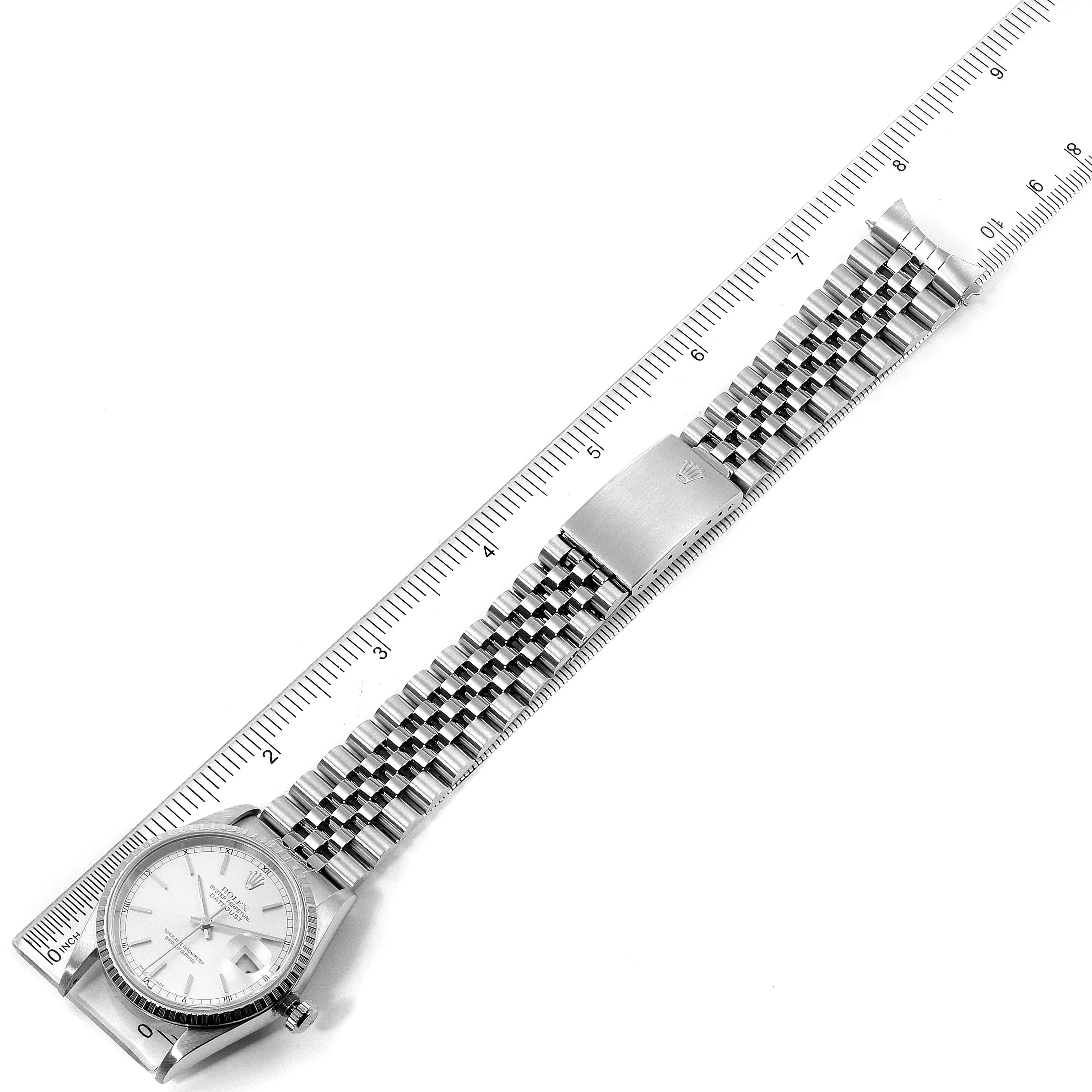 The image shows a Rolex Datejust 16220 Men's Stainless Steel Silver Dial 16220 Men's Stainless Steel Silver Dial watch laid flat with its face and Jubilee bracelet aligned to a ruler.