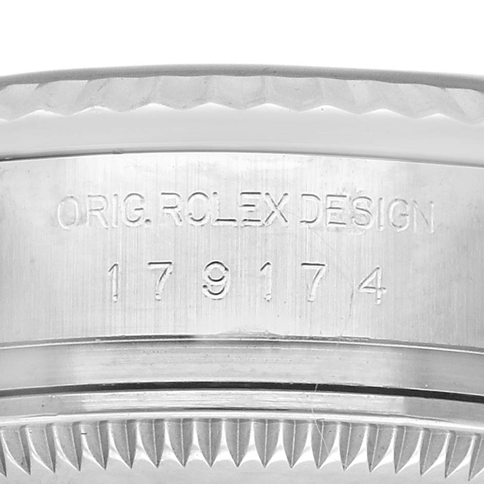 The image shows a close-up of the side case of a Rolex Datejust 179174 Women's Stainless Steel Black Dial 179174 Women's Stainless Steel Black Dial, focusing on the reference number engraving.