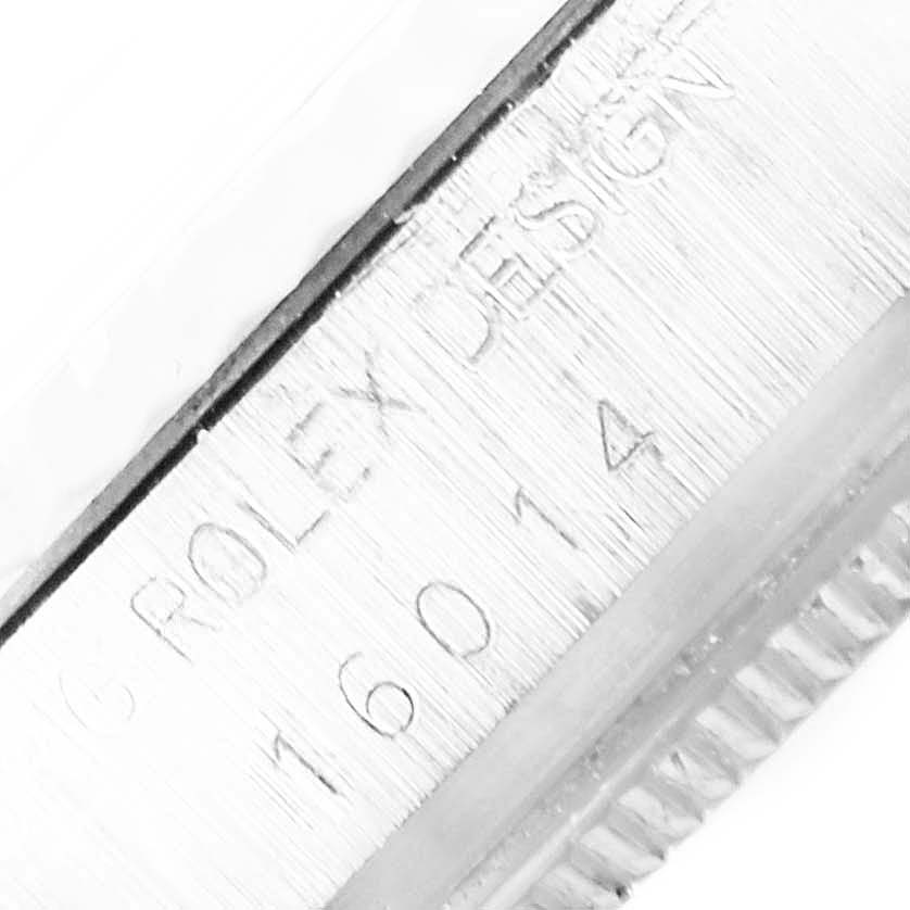 This close-up image shows the side engraving of the model number "16014" and "Rolex Design" on a Vintage Collection Rolex watch.