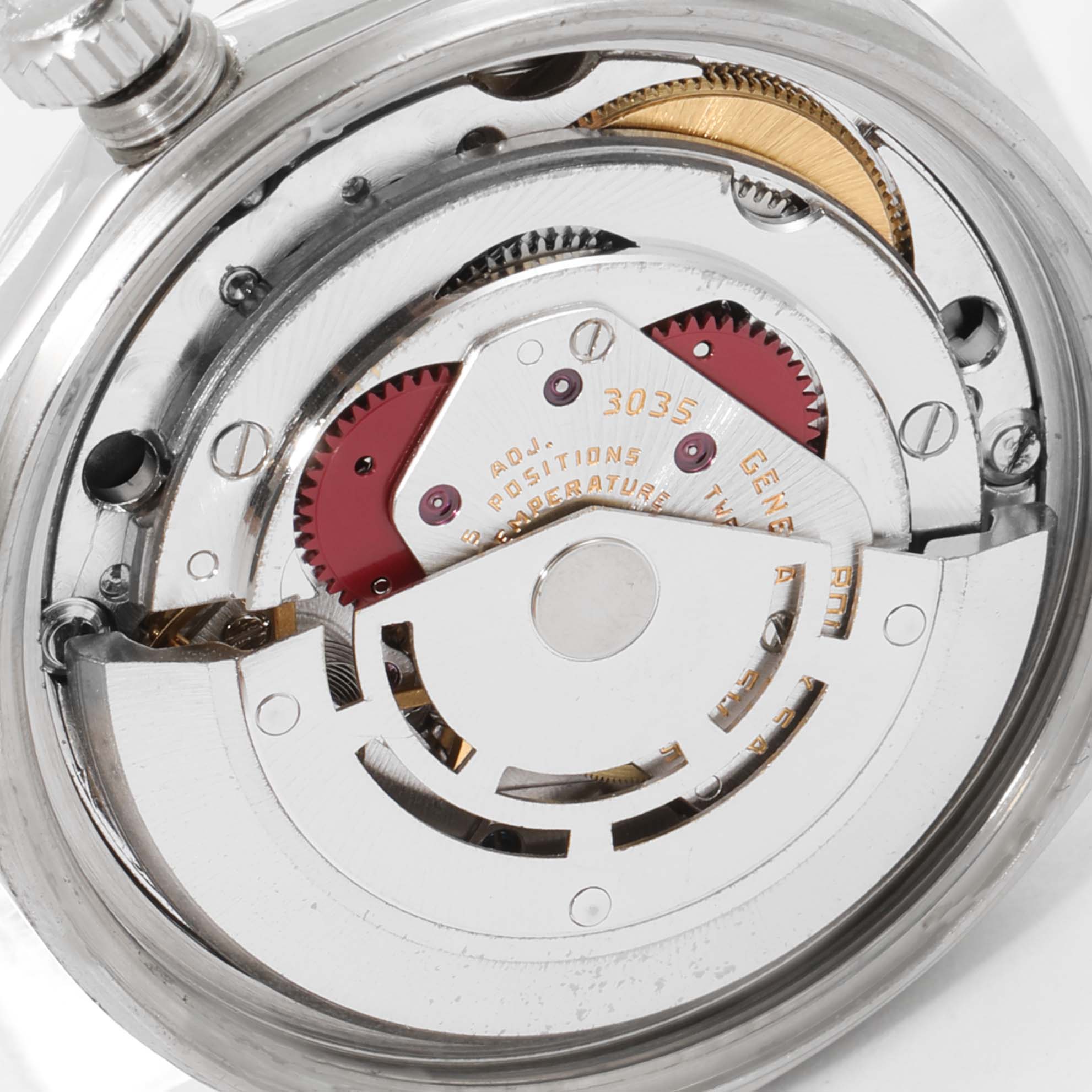 The image shows an internal view of the Rolex Vintage Collection 16014 Men's Stainless Steel Silver Dial 16014 Men's Stainless Steel Silver Dial watch, focusing on the movement and rotor mechanism.