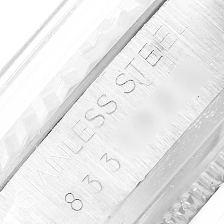 The image shows a close-up of the side engraving on the case of the Rolex Vintage Collection 16014 Men's Stainless Steel Silver Dial 16014 Men's Stainless Steel Silver Dial watch, highlighting its "STAINLESS STEEL" inscription.