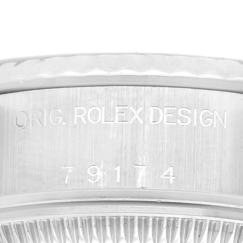 The image shows a close-up of the case side of a Rolex Datejust 79174 Women's Stainless Steel Silver Dial 79174 Women's Stainless Steel Silver Dial, highlighting the engraved model number.