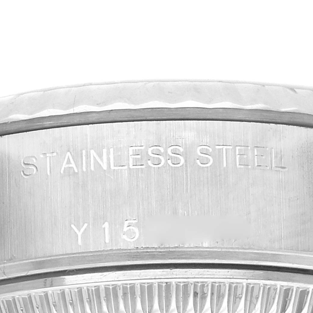 The image shows a close-up of the side of a Rolex Datejust 79174 Women's Stainless Steel Silver Dial 79174 Women's Stainless Steel Silver Dial, highlighting the stainless steel part with engraved text.