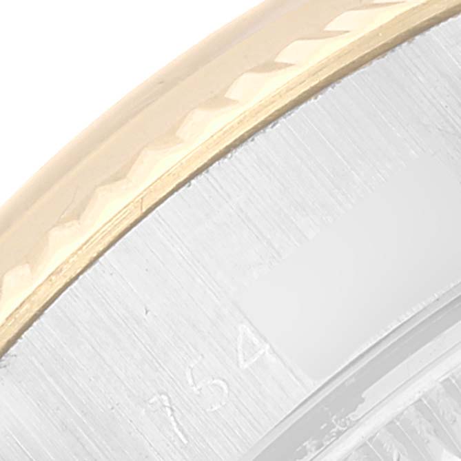 This image shows a close-up angle of a Rolex Datejust 6917 Women's Steel and Gold (two tone) Champagne Dial 6917 Women's Steel and Gold (two tone) Champagne Dial watch, focusing on the gold bezel and part of the case.