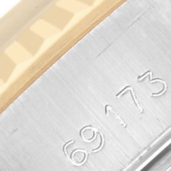 The image shows a close-up of the edge with the reference number and part of the Rolex Datejust 69173 Women
s Steel and Gold (two tone) Champagne Dial 69173 Women
s Steel and Gold (two tone) Champagne Dial
s fluted bezel.