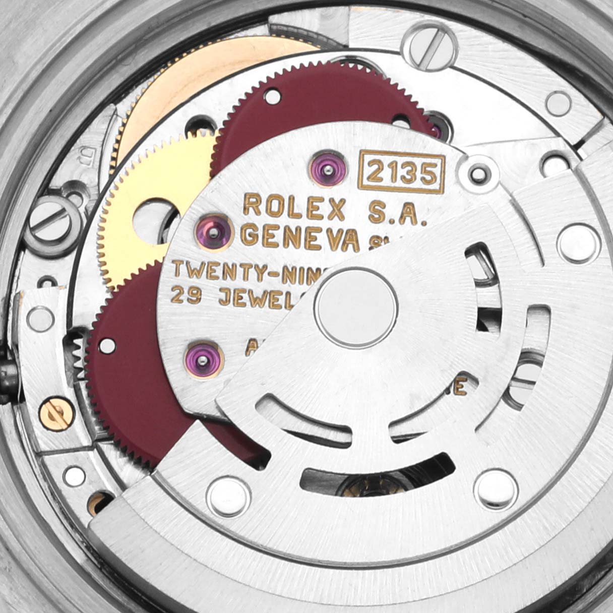 The image shows a close-up of the Rolex Datejust 69173 Women
s Steel and Gold (two tone) Champagne Dial 69173 Women
s Steel and Gold (two tone) Champagne Dial movement with gears and jewels visible.
