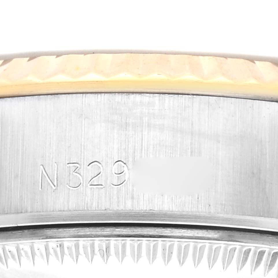 The image shows a close-up of the side of a Rolex Datejust 69173 Women's Steel and Gold (two tone) Champagne Dial 69173 Women's Steel and Gold (two tone) Champagne Dial, focusing on the case edge and part of the bezel.