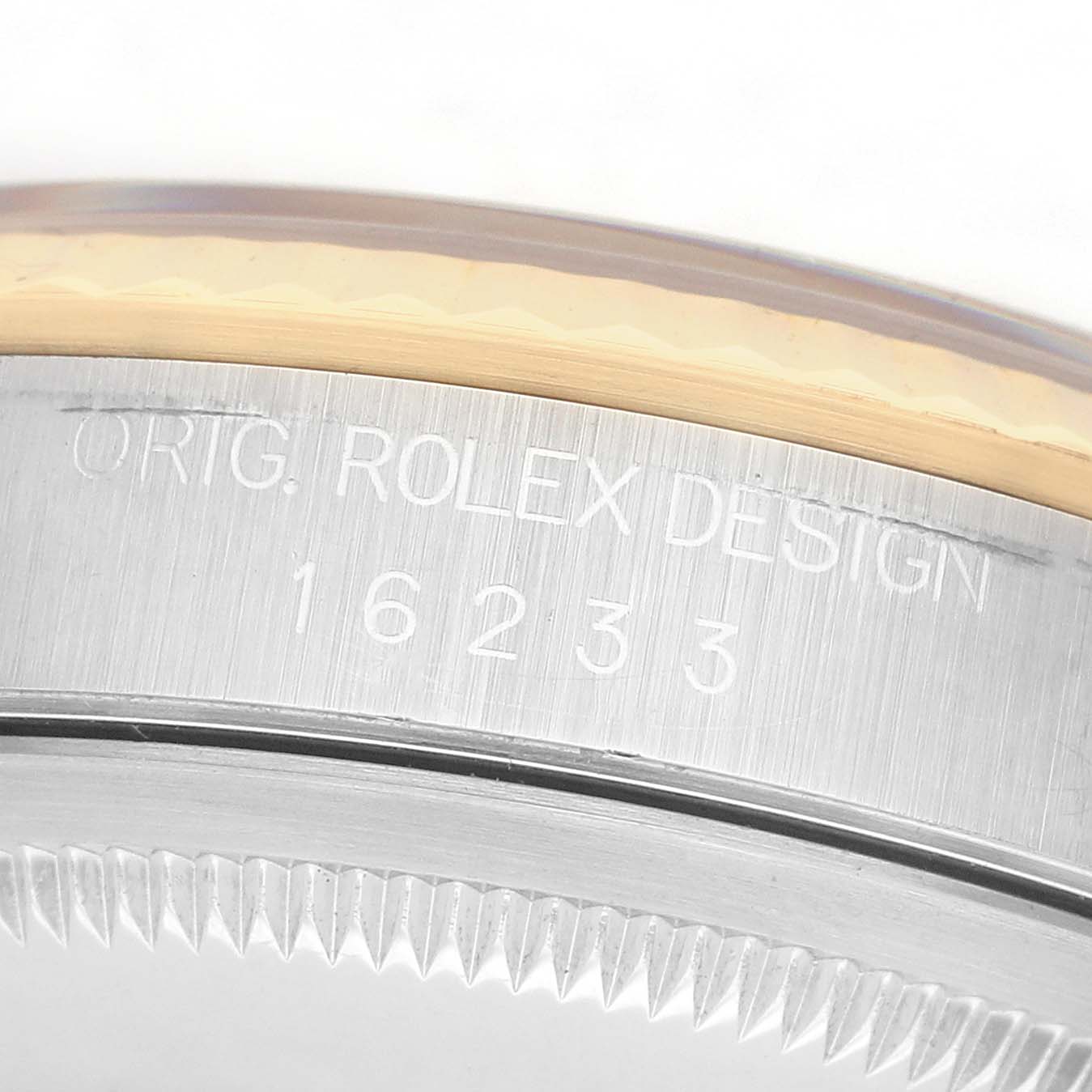 The image shows a close-up angle of the Rolex Datejust 16233 Men's Steel and Gold (two tone) Grey Dial model's case, featuring the engraved model number and design details.