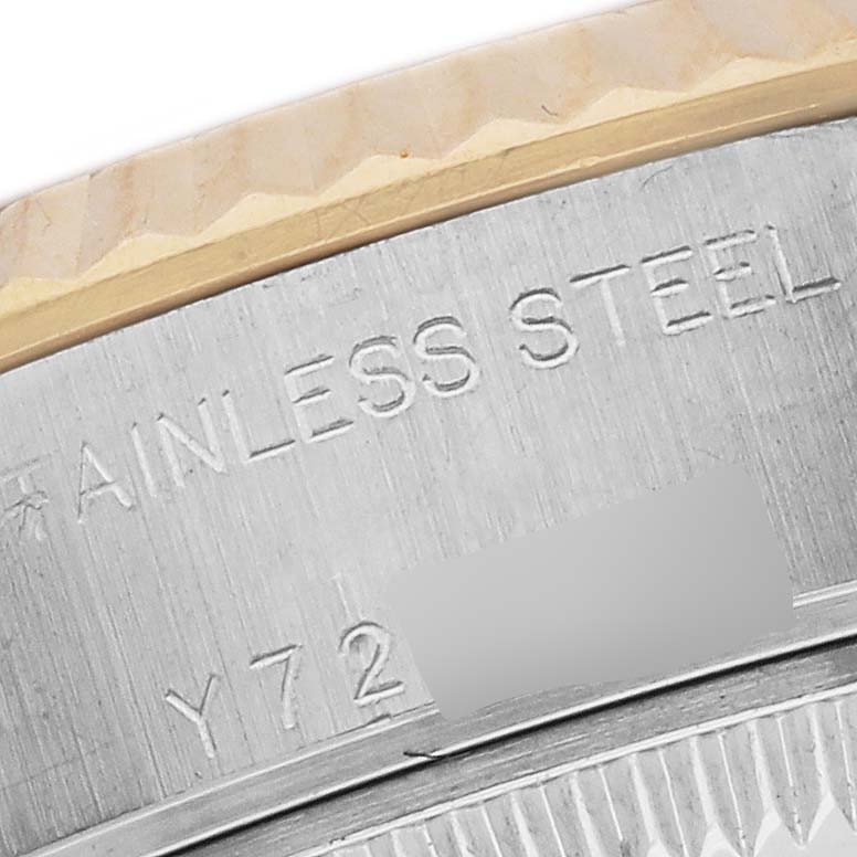 The image shows a close-up of the side of a Rolex Datejust 79173 Women's Steel and Gold (two tone) White Dial 79173 Women's Steel and Gold (two tone) White Dial, highlighting the stainless steel and part of the bezel.