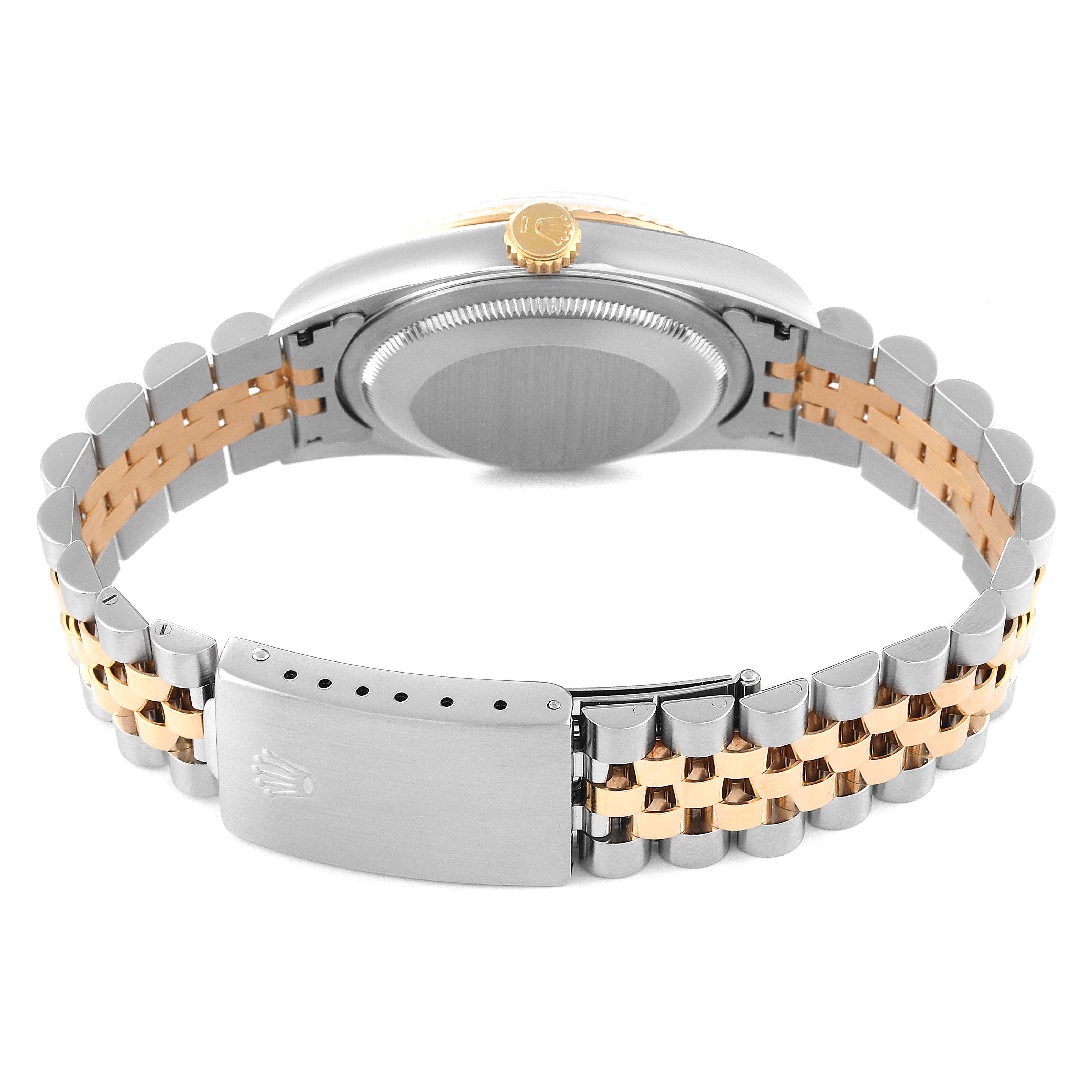 The image shows the back view of a Rolex Datejust 16233 Men's Steel and Gold (two tone) White Dial 16233 Men's Steel and Gold (two tone) White Dial model, focusing on its case back, crown, and two-tone bracelet with clasp.