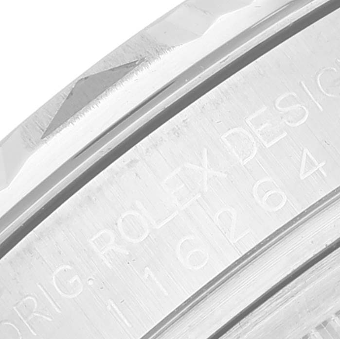 The image shows a close-up of the engraved side of a Rolex Turn-o-Graph 116264 Men's Stainless Steel Black Dial watch bezel.