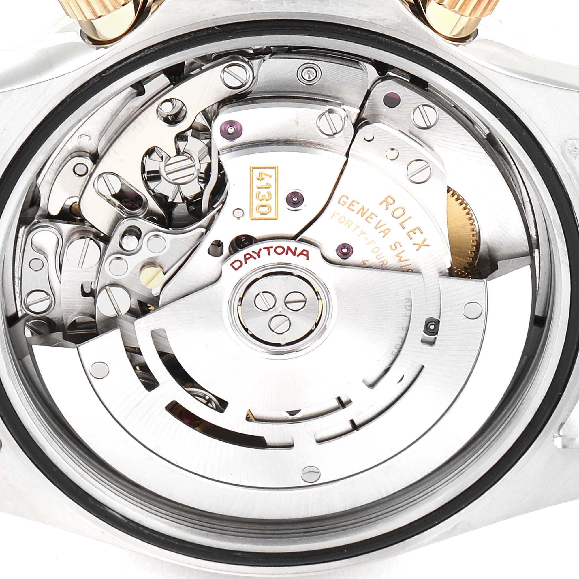 The image shows the intricate inner mechanics and rotor of the Rolex Daytona 116523 Men
s Steel and Gold (two tone) Blue Dial 116523 Men
s Steel and Gold (two tone) Blue Dial model watch.