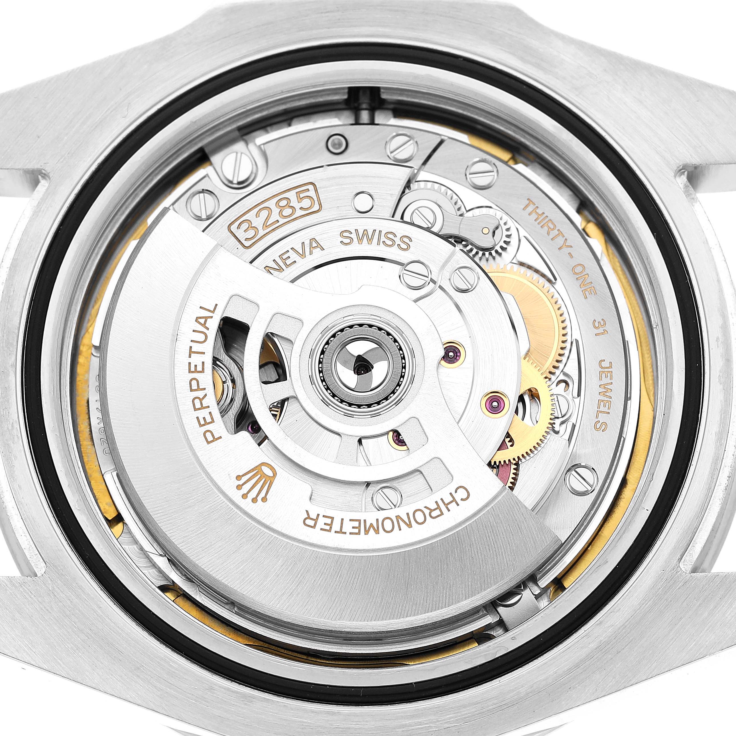 The image shows the back view of a Rolex Explorer 226570 Men's Stainless Steel Black Dial, highlighting its movement and internal mechanics.