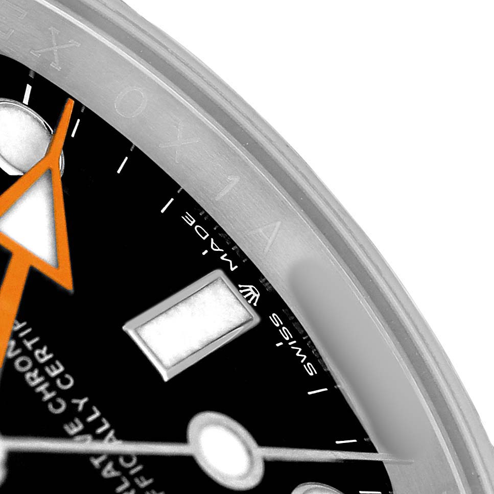 The image shows a close-up of the Rolex Explorer 226570 Men's Stainless Steel Black Dial watch, highlighting part of the bezel, dial, and hands.