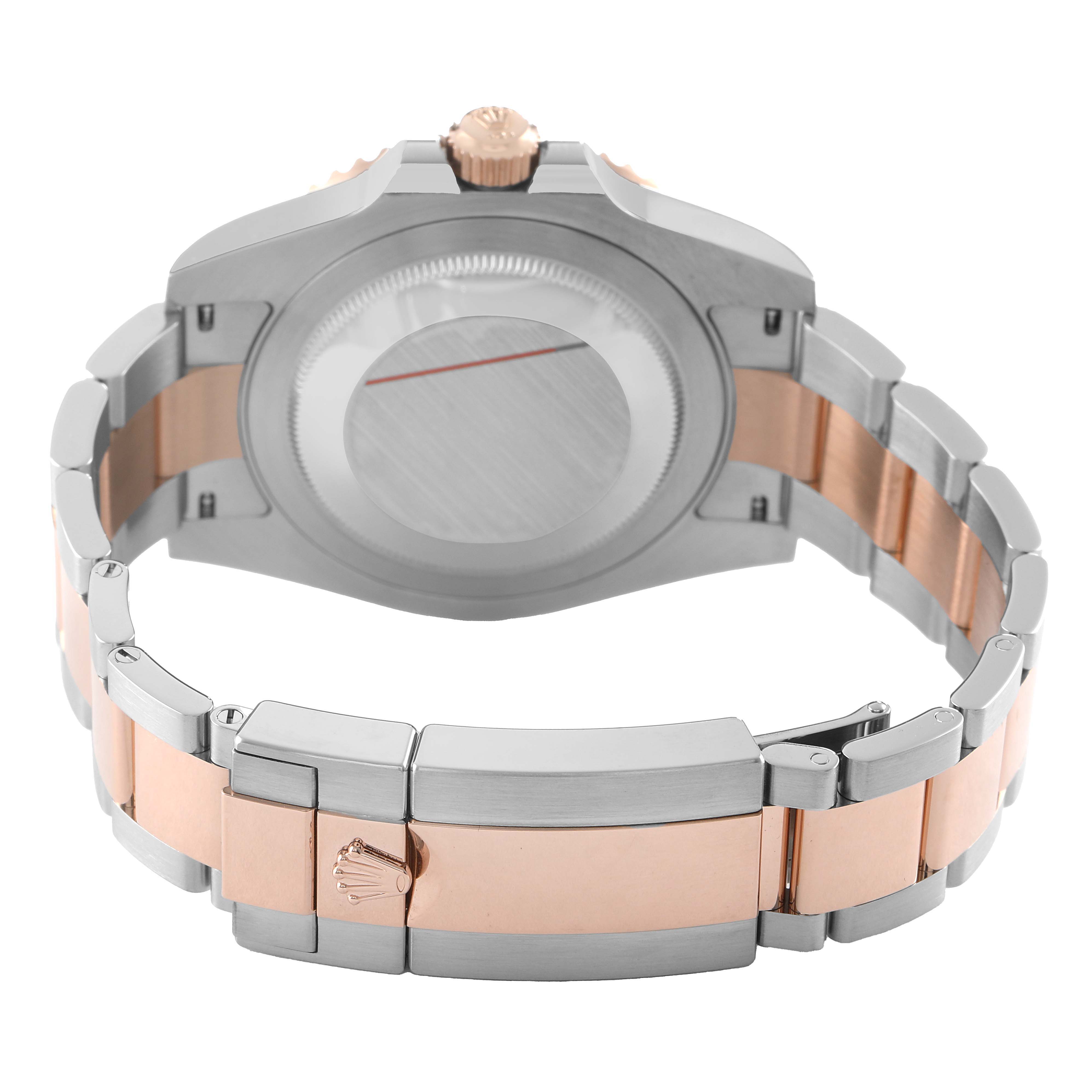 The image shows the back of a Rolex GMT-Master 126711 Men's Steel and Gold (two tone) Black Dial watch, focusing on the case back and two-tone bracelet.