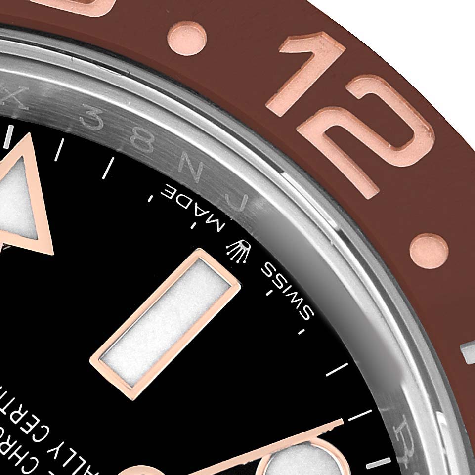 The image shows a close-up of the Rolex GMT-Master 126711 Men's Steel and Gold (two tone) Black Dial's bezel and dial, highlighting the rose gold markers and numerals.
