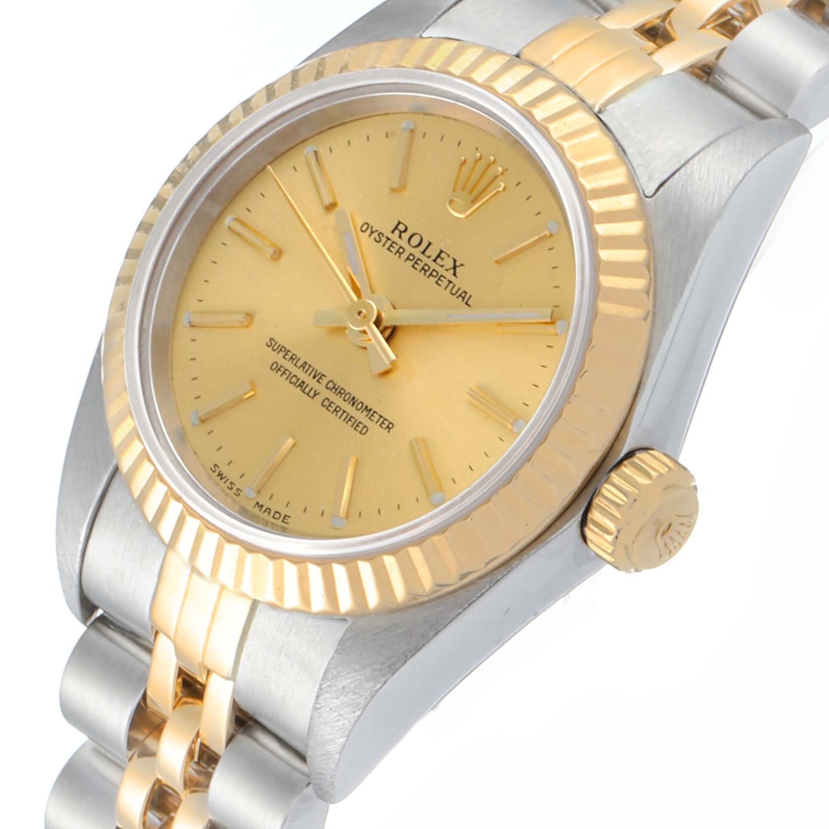 This image shows a close-up view of a Rolex Oyster Perpetual 76193 Women
s Steel and Gold (two tone) Champagne Dial 76193 Women
s Steel and Gold (two tone) Champagne Dial watch, highlighting its gold bezel, crown, and bracelet.