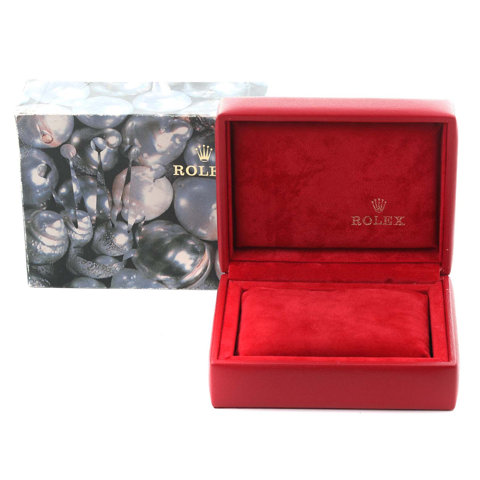 The image shows a Rolex Oyster Perpetual 76183 Women's Steel and Gold (two tone) Silver Dial 76183 Women's Steel and Gold (two tone) Silver Dial watch box and packaging at an angle displaying the exterior and interior.