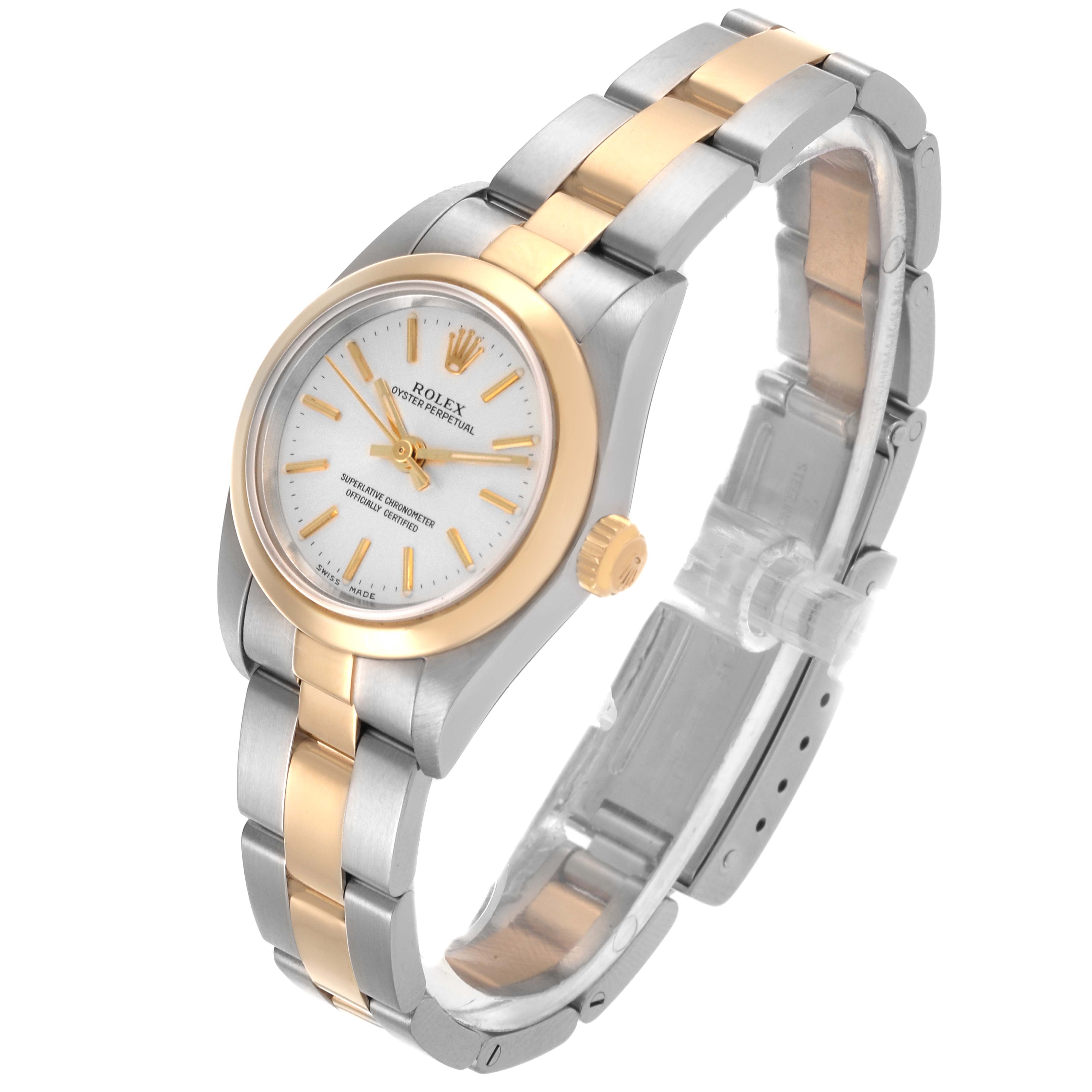 The Rolex Oyster Perpetual 76183 Women's Steel and Gold (two tone) Silver Dial 76183 Women's Steel and Gold (two tone) Silver Dial watch is shown at an angle displaying the front face, bezel, case, and bracelet.