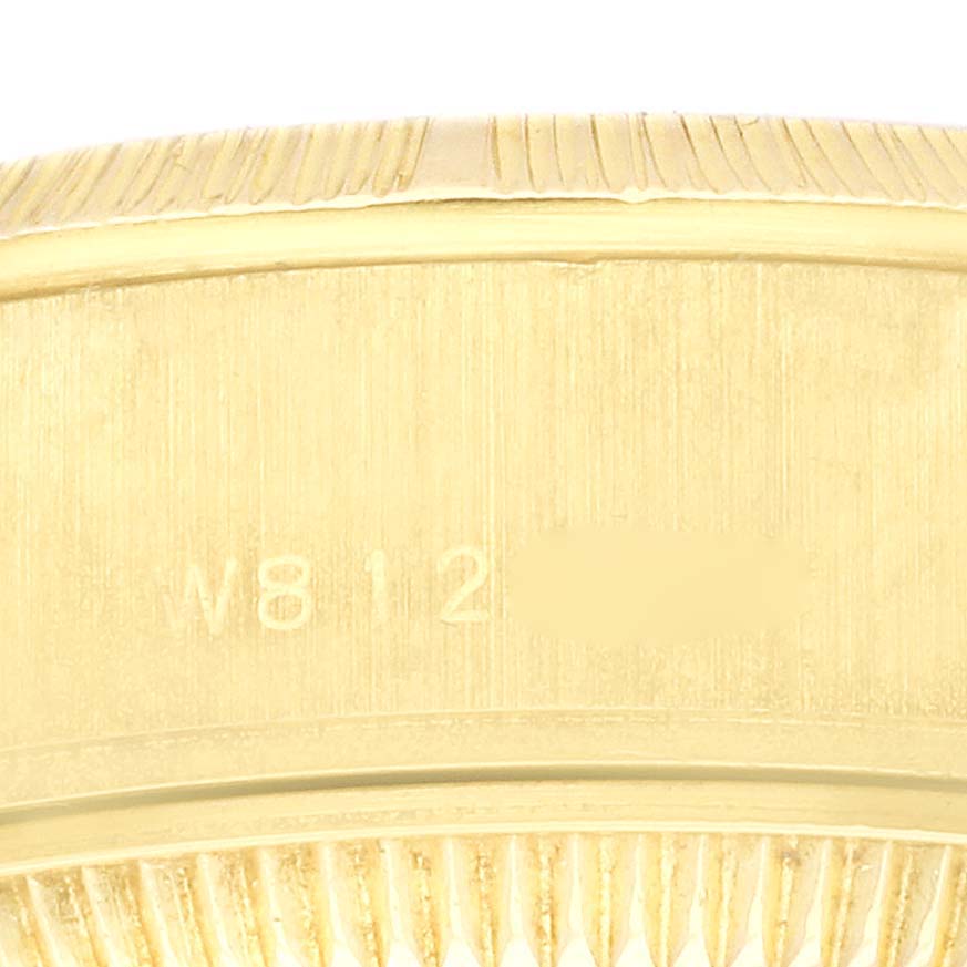 The image shows the side of the Rolex President 69278 Women's Yellow Gold Champagne Dial 69278 Women's Yellow Gold Champagne Dial watch case, featuring the engraved serial number.