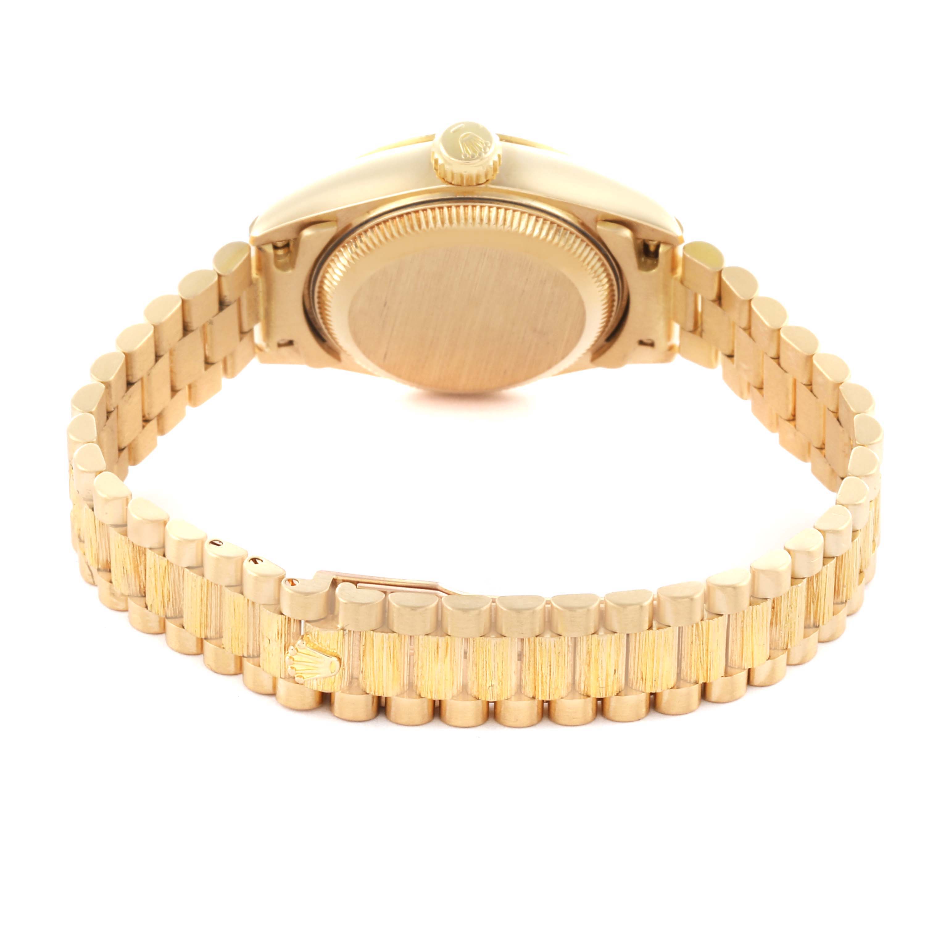 The image shows the back view of the Rolex President 69278 Women's Yellow Gold Champagne Dial 69278 Women's Yellow Gold Champagne Dial model, focusing on the case back and the gold bracelet.