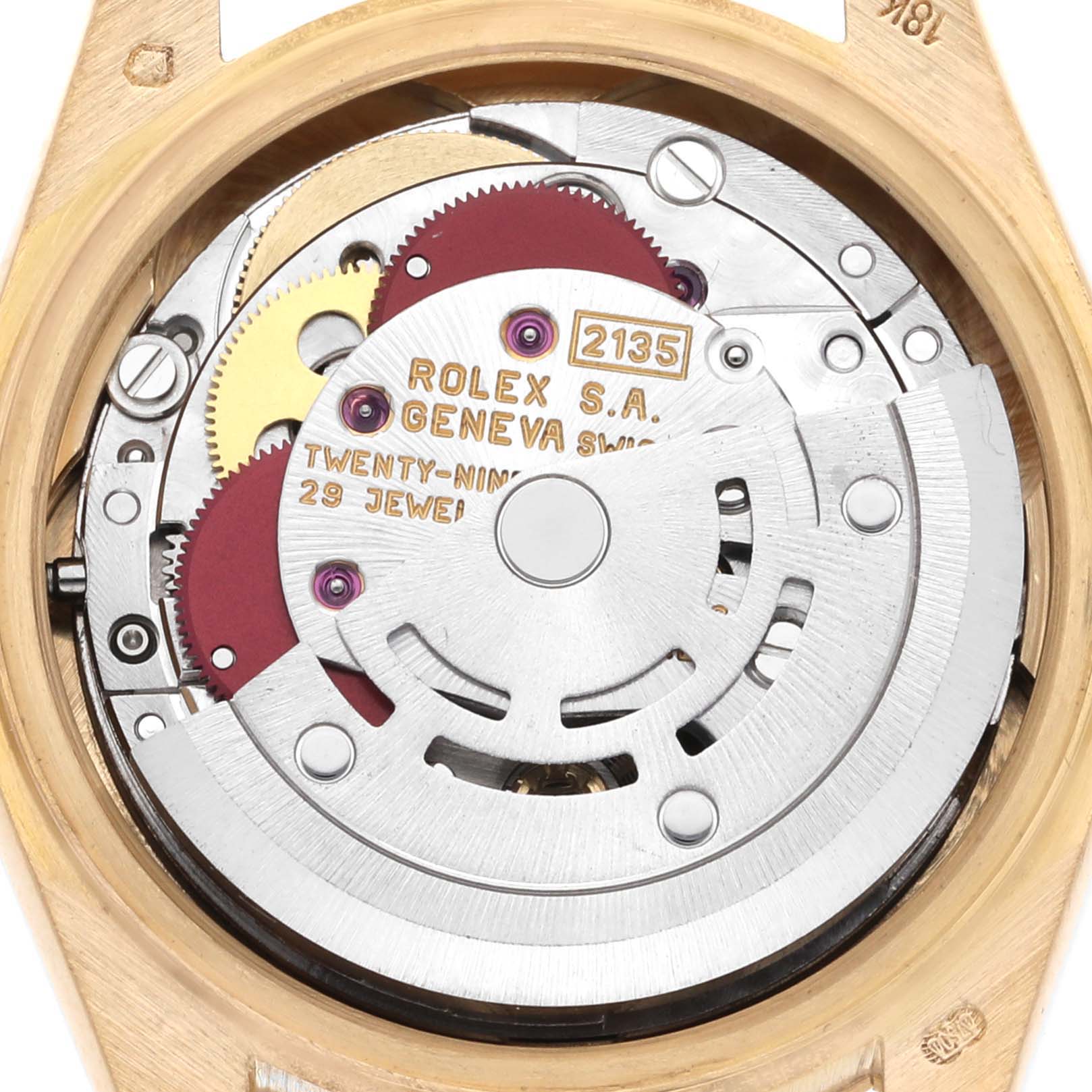 The image shows the inner mechanism of a Rolex President 69278 Women's Yellow Gold Champagne Dial 69278 Women's Yellow Gold Champagne Dial watch from a top-down angle, highlighting gears and jewels.
