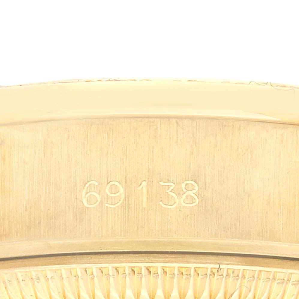 The image shows the reference number engraved inside the casing of a Rolex President 69138 Women's Yellow Gold White Dial 69138 Women's Yellow Gold White Dial model watch.