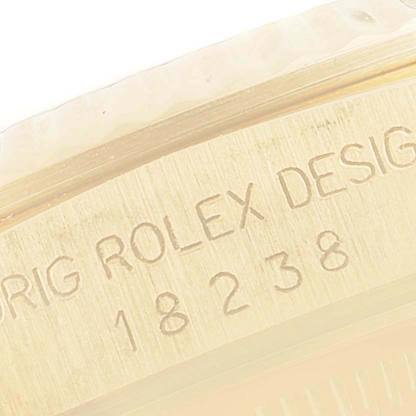 The image shows a close-up of the engraved model number and "ROLEX DESIGN" text on the case of a Rolex President 18238 Men's Yellow Gold Black Dial 18238 Men's Yellow Gold Black Dial watch.