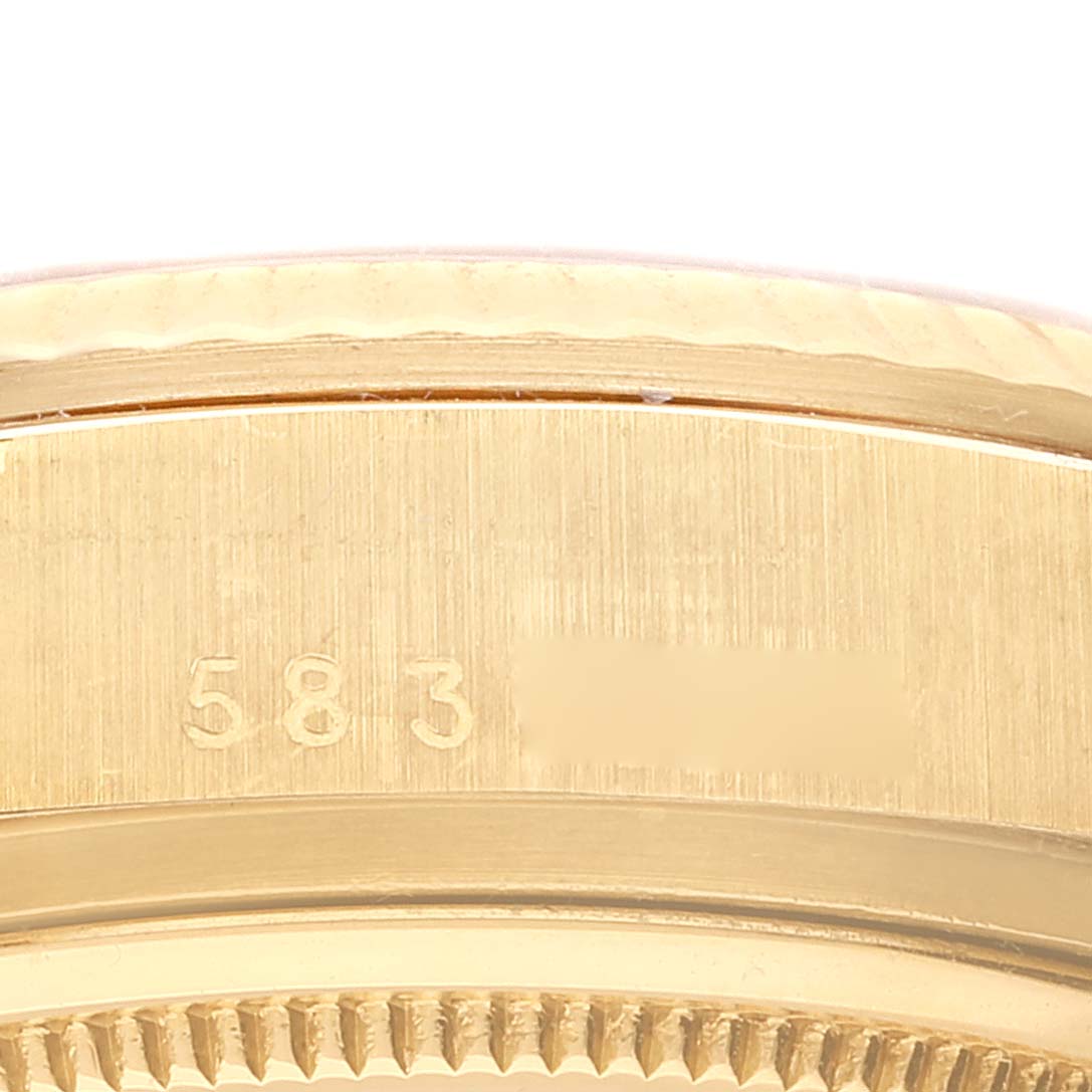 This image shows a close-up of the side case and bezel with a serial number engraving of a Rolex President 18038 Men
s Yellow Gold Champagne Dial 18038 Men
s Yellow Gold Champagne Dial watch.