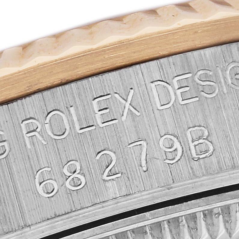 The image shows a close-up of the case edge and bezel with engravings on the Rolex President 68279 Women's White Gold Pink Dial 68279 Women's White Gold Pink Dial model.