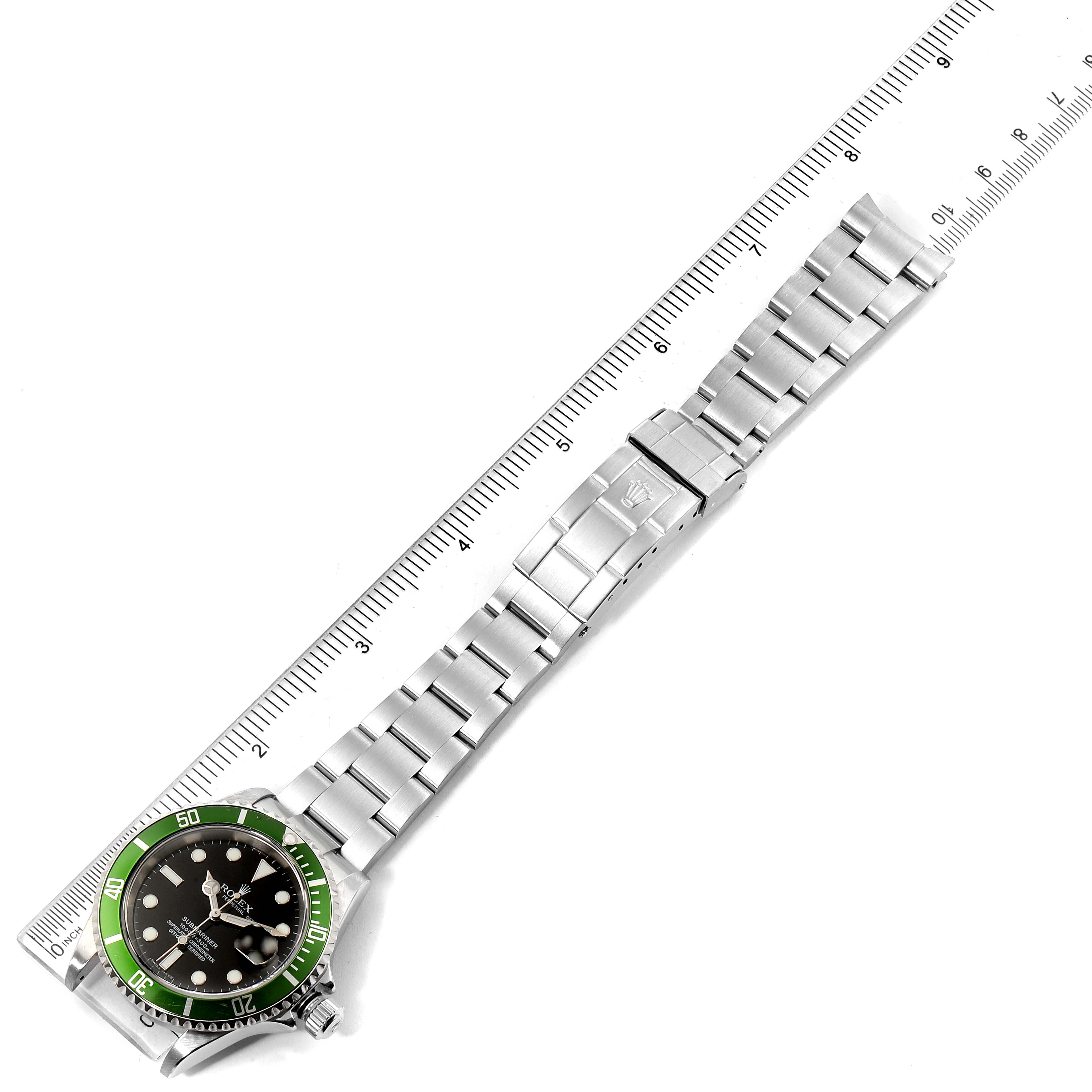 The image shows a top view of a Rolex Submariner 16610LV Men's Stainless Steel Black Dial 16610LV Men's Stainless Steel Black Dial watch, highlighting its green bezel, black dial, and stainless steel bracelet.