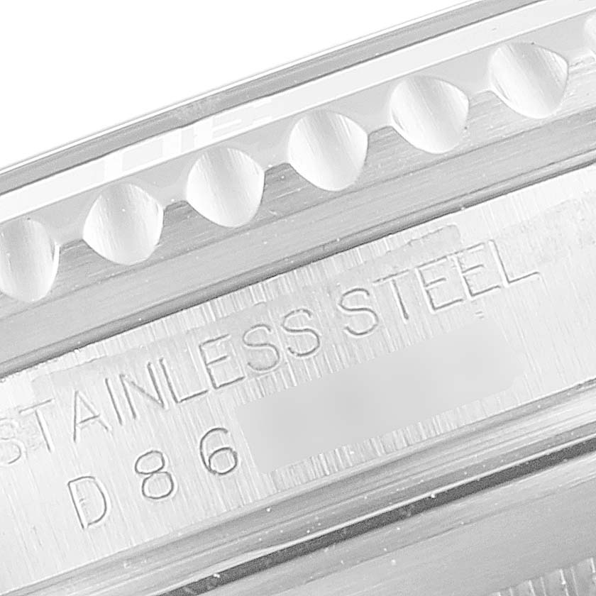 This image shows a close-up angle of the bezel and the engraved serial number of the Rolex Submariner 16610LV Men's Stainless Steel Black Dial 16610LV Men's Stainless Steel Black Dial watch.