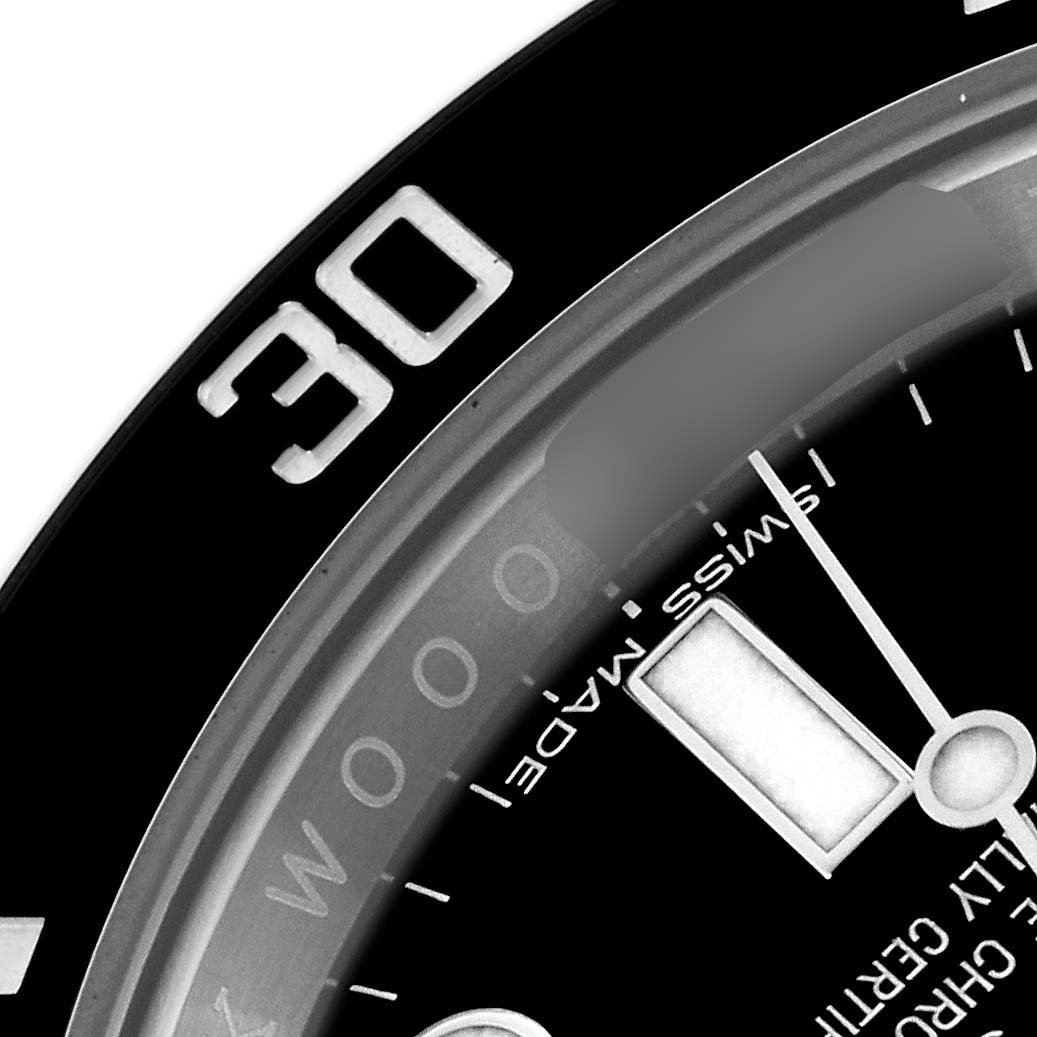 The image shows a close-up of the bezel and a portion of the dial of a Rolex Submariner 114060 Men's Stainless Steel Black Dial 114060 Men's Stainless Steel Black Dial watch, highlighting the 30-minute marker.