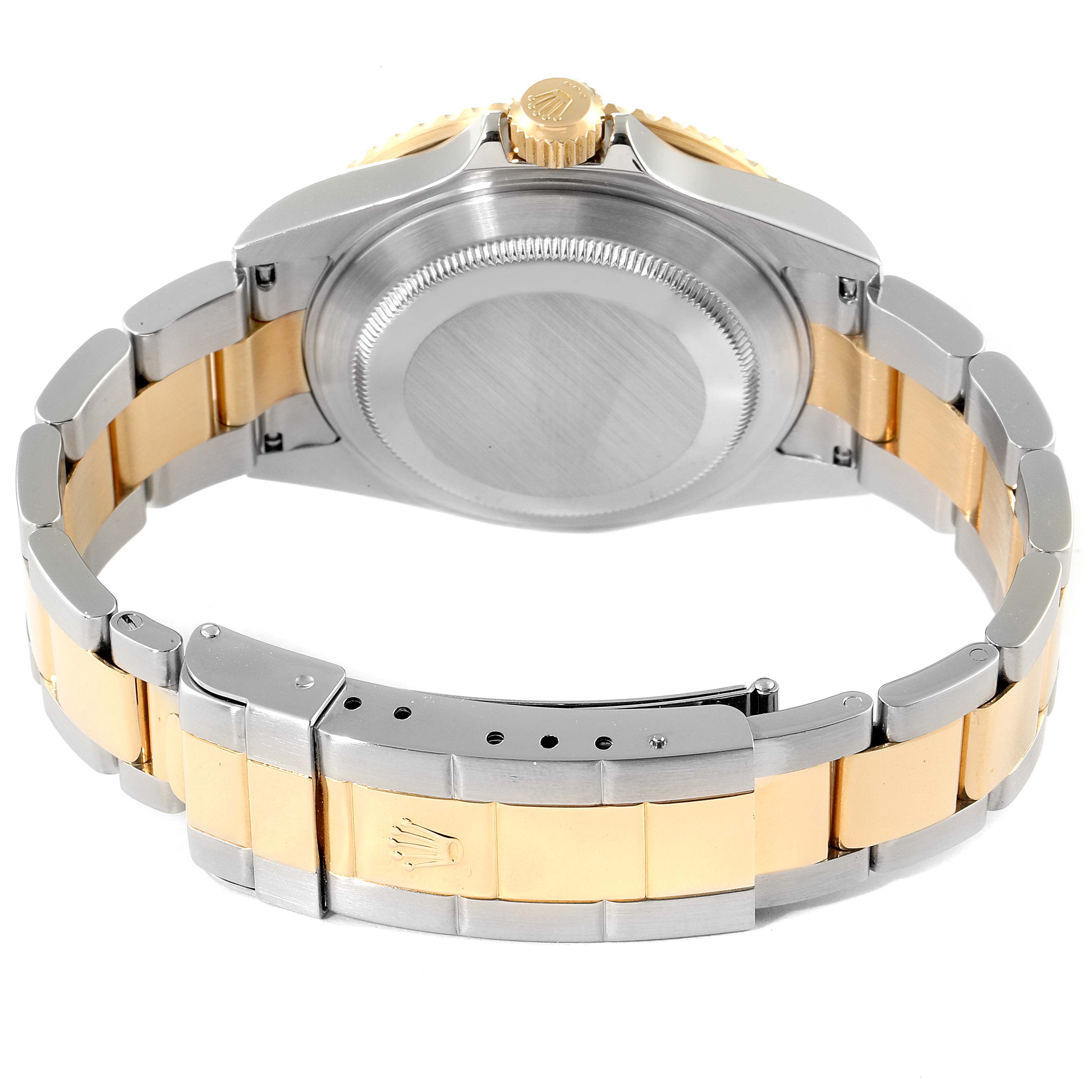 The image shows the backside of a Rolex Submariner 16613 Men
s Steel and Gold (two tone) Grey Dial 16613 Men
s Steel and Gold (two tone) Grey Dial watch, highlighting its two-tone bracelet and case back.